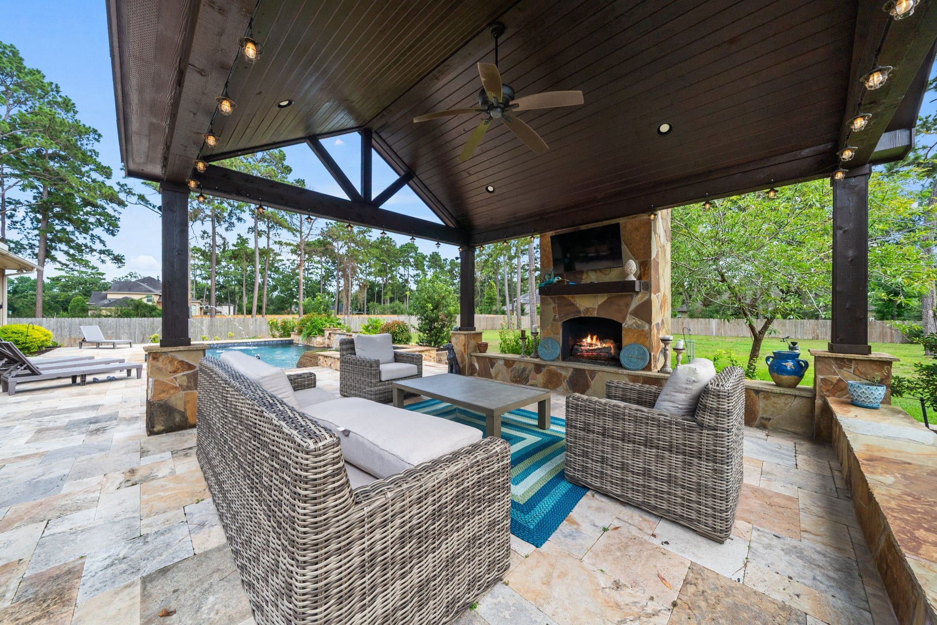4426 Silver Jade Drive, Spring, TX 77386 Retreat to the glow of the magnificent stone fireplace on cooler nights, or transition the space seamlessly into the ultimate open-air venue for sun-drenched summer gatherings that flow long into the evening.