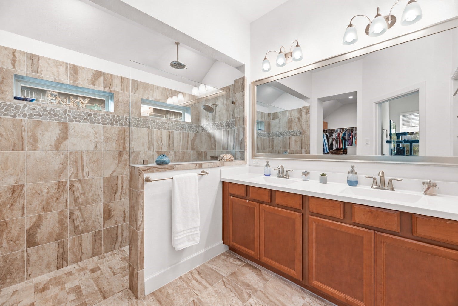 18203 Burnett Willow Lane, Cypress, TX 77433 Luxurious primary bathroom featuring a spacious tiled floor to celling walk-in super shower.