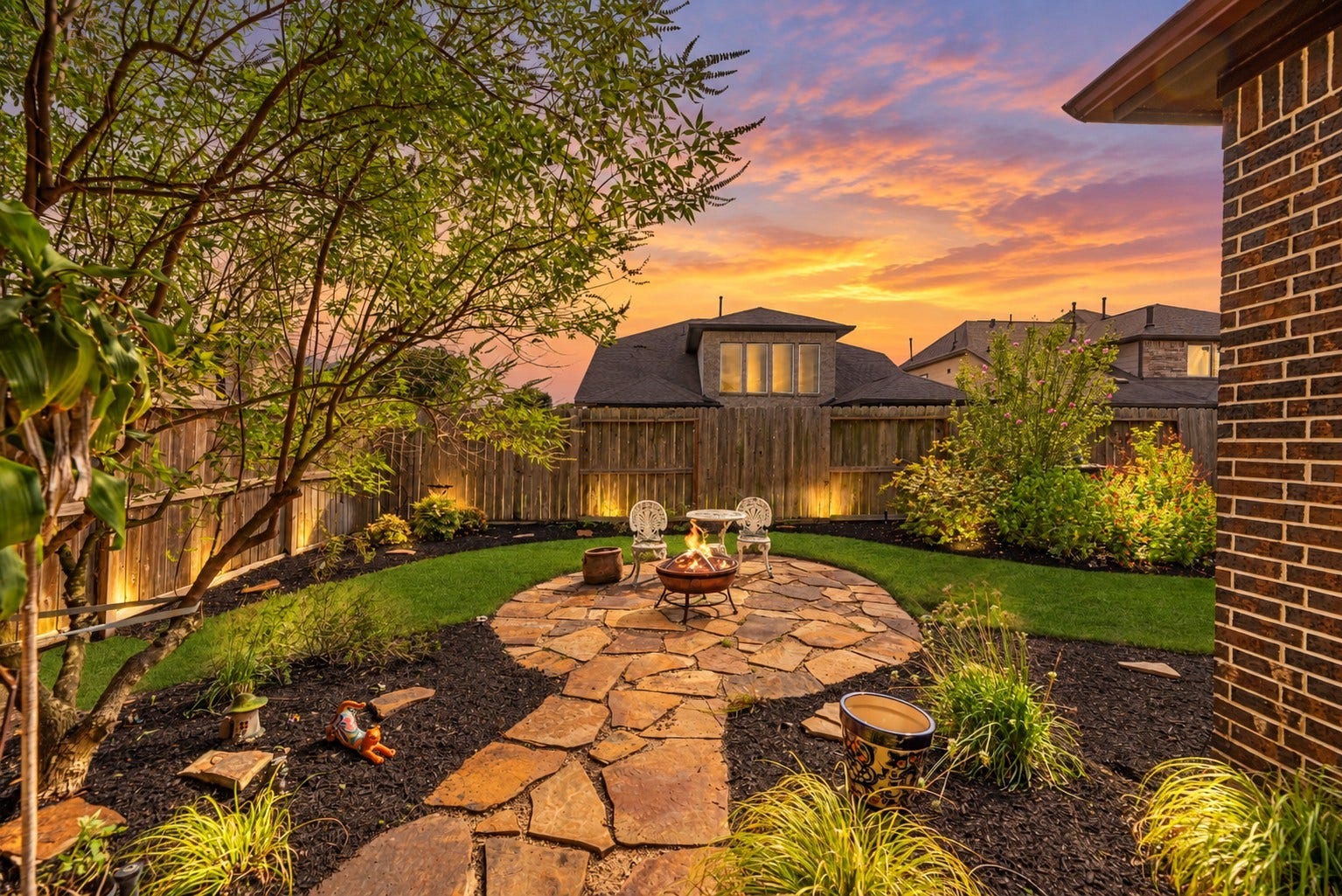 18203 Burnett Willow Lane, Cypress, TX 77433 Step into backyard oasis featuring a flagstone patio perfect for a firepit and seating.