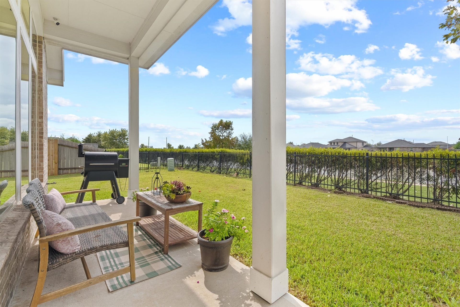 9034 Japonica Drive, Rosenberg, TX 77469 Fully fenced with clean wrought-iron detailing, offering unobstructed views of the water right from your back yard.