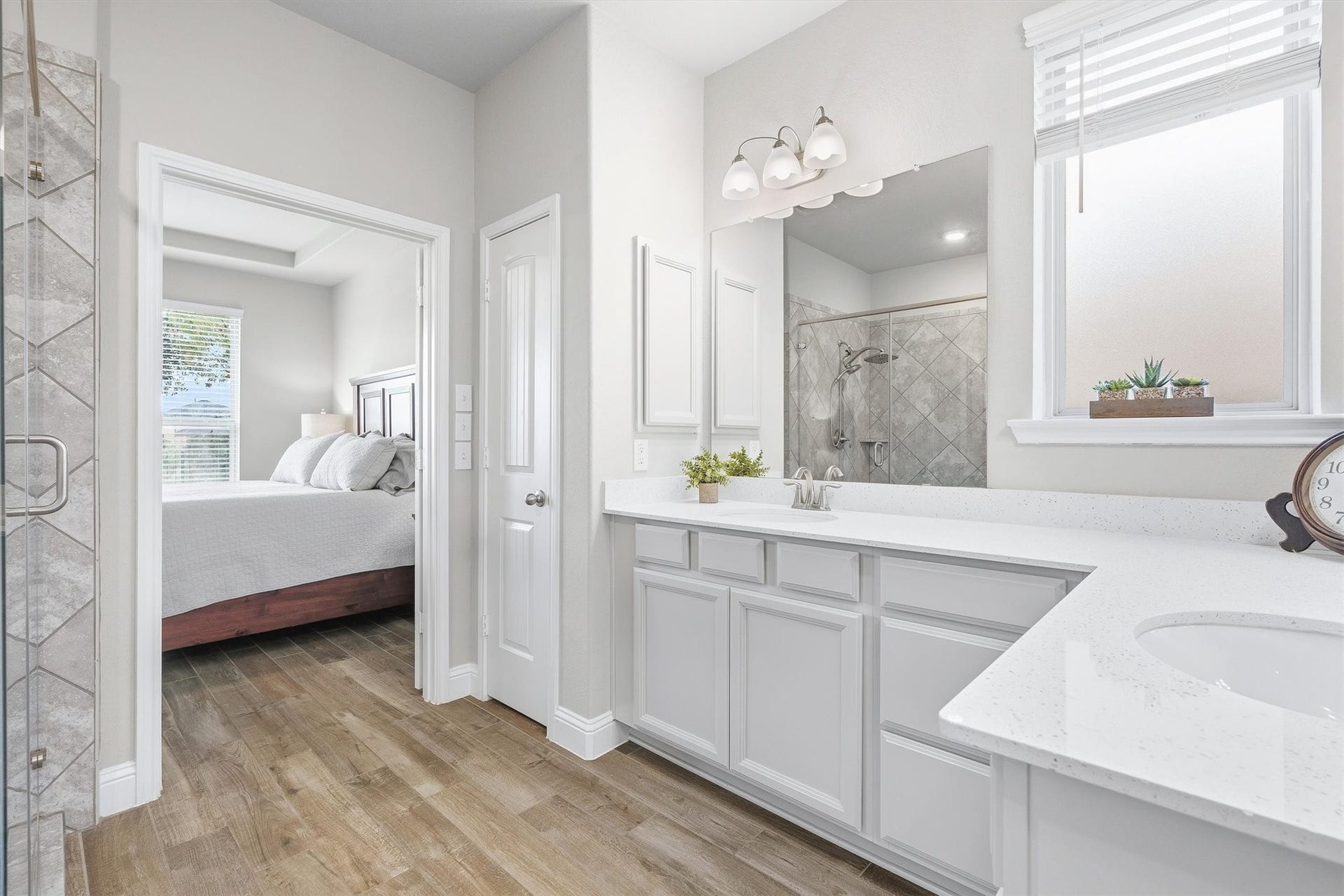 9034 Japonica Drive, Rosenberg, TX 77469 Step through elegant double doors into your private spa-like en-suite, complete with a sprawling double vanity, crisp quartz countertops, and abundant storage.