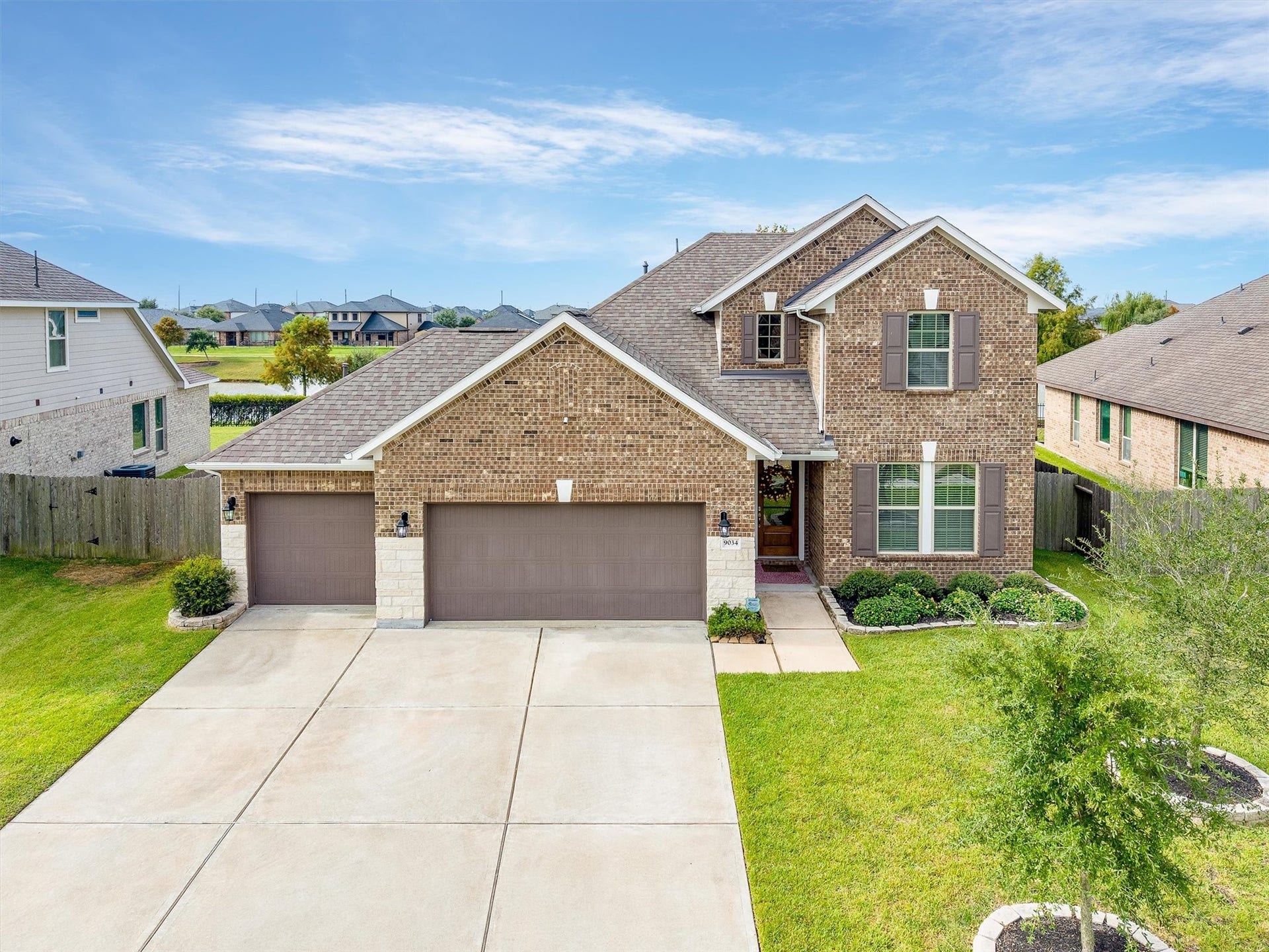 9034 Japonica Drive, Rosenberg, TX 77469 Home sweet home looks pretty good under blue skies.