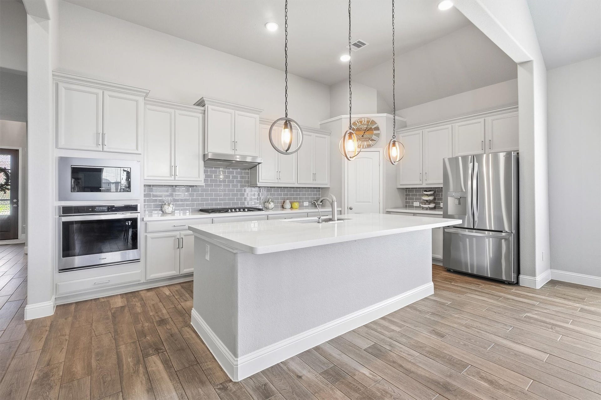 9034 Japonica Drive, Rosenberg, TX 77469 Island dreams do come true. Obsessed with the crisp lighting and clean lines in this kitchen!