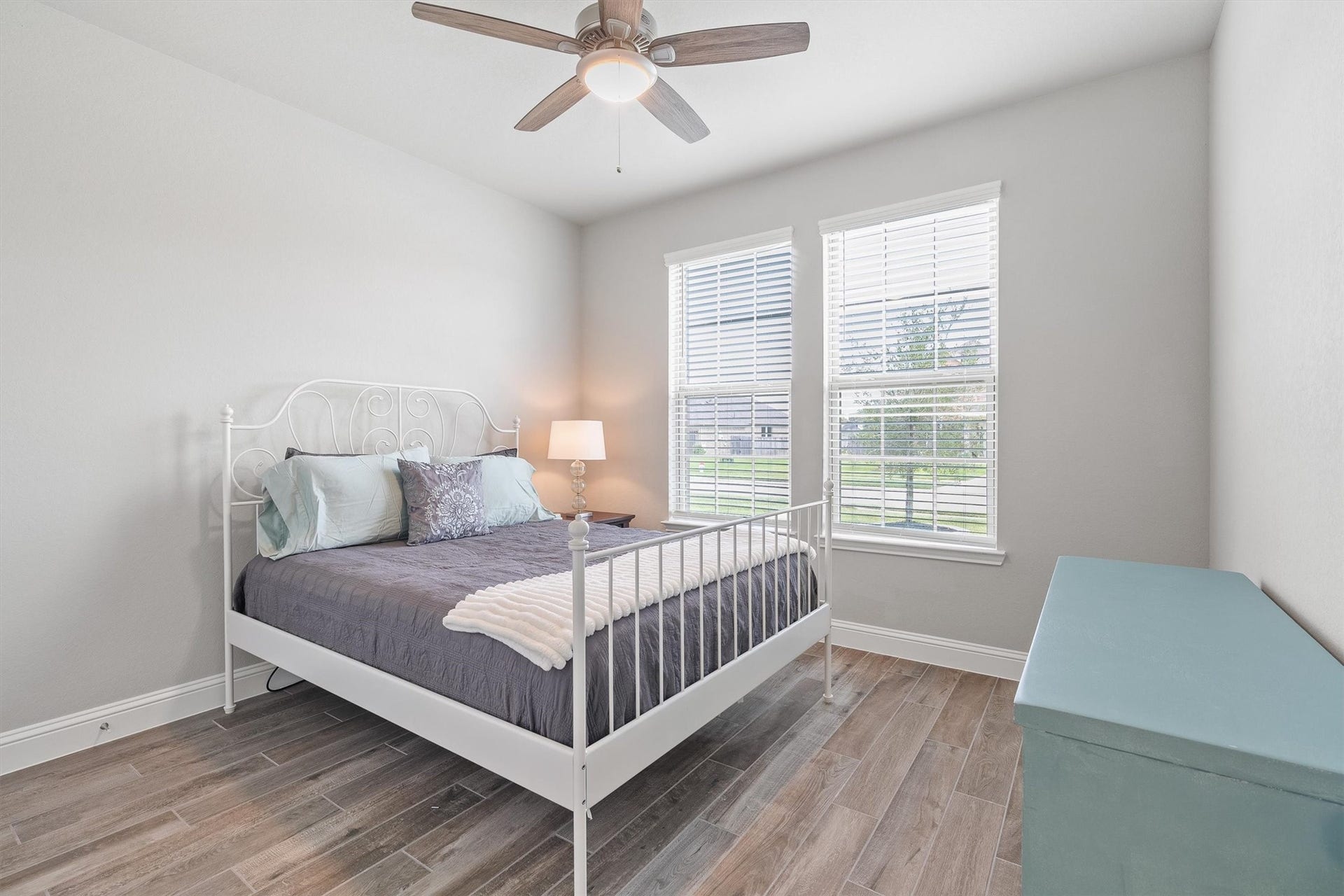 9034 Japonica Drive, Rosenberg, TX 77469 First-floor bedroom: soft tones, endless natural light, and pure serenity.