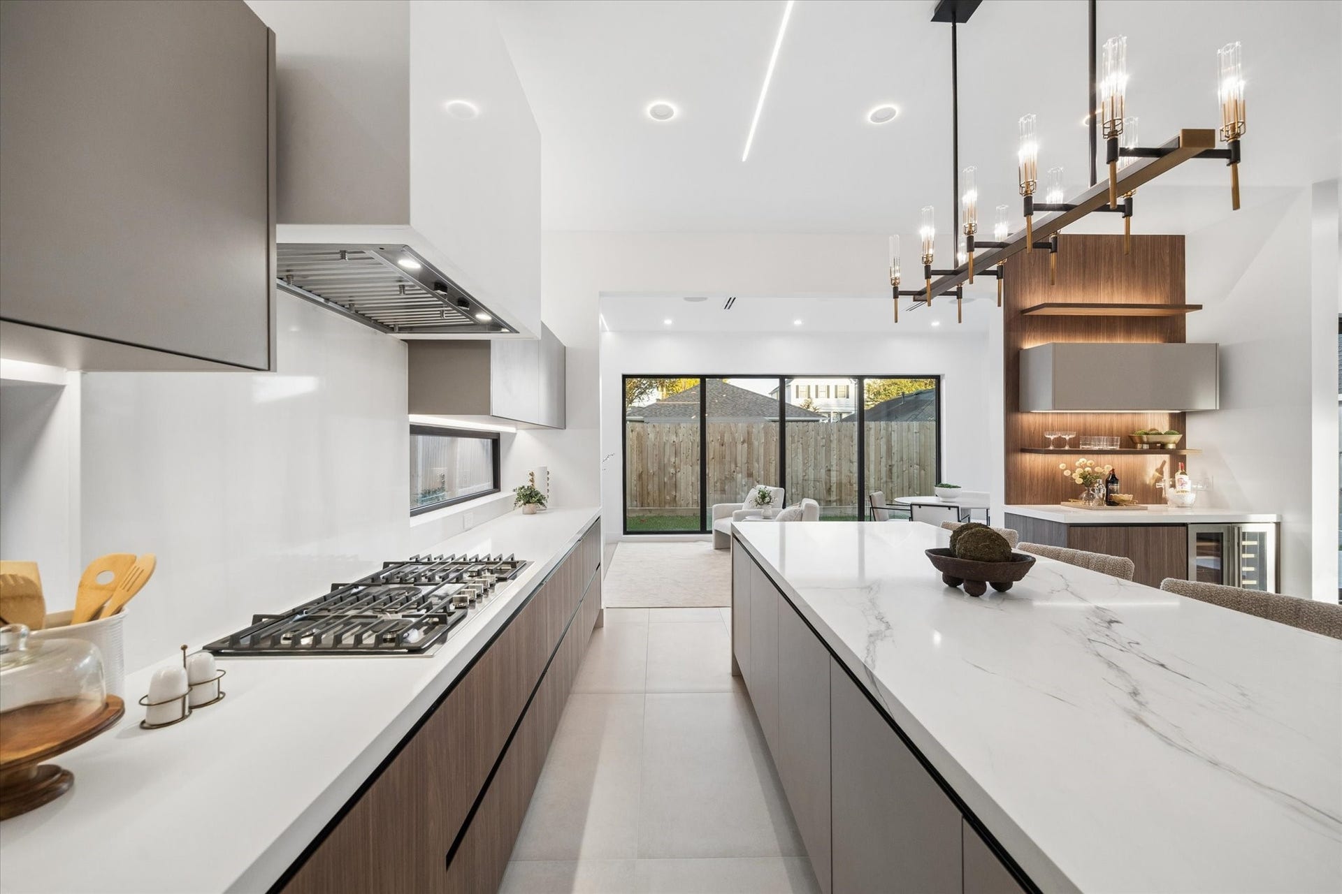Expansive countertops with elegant lighting chandelier.