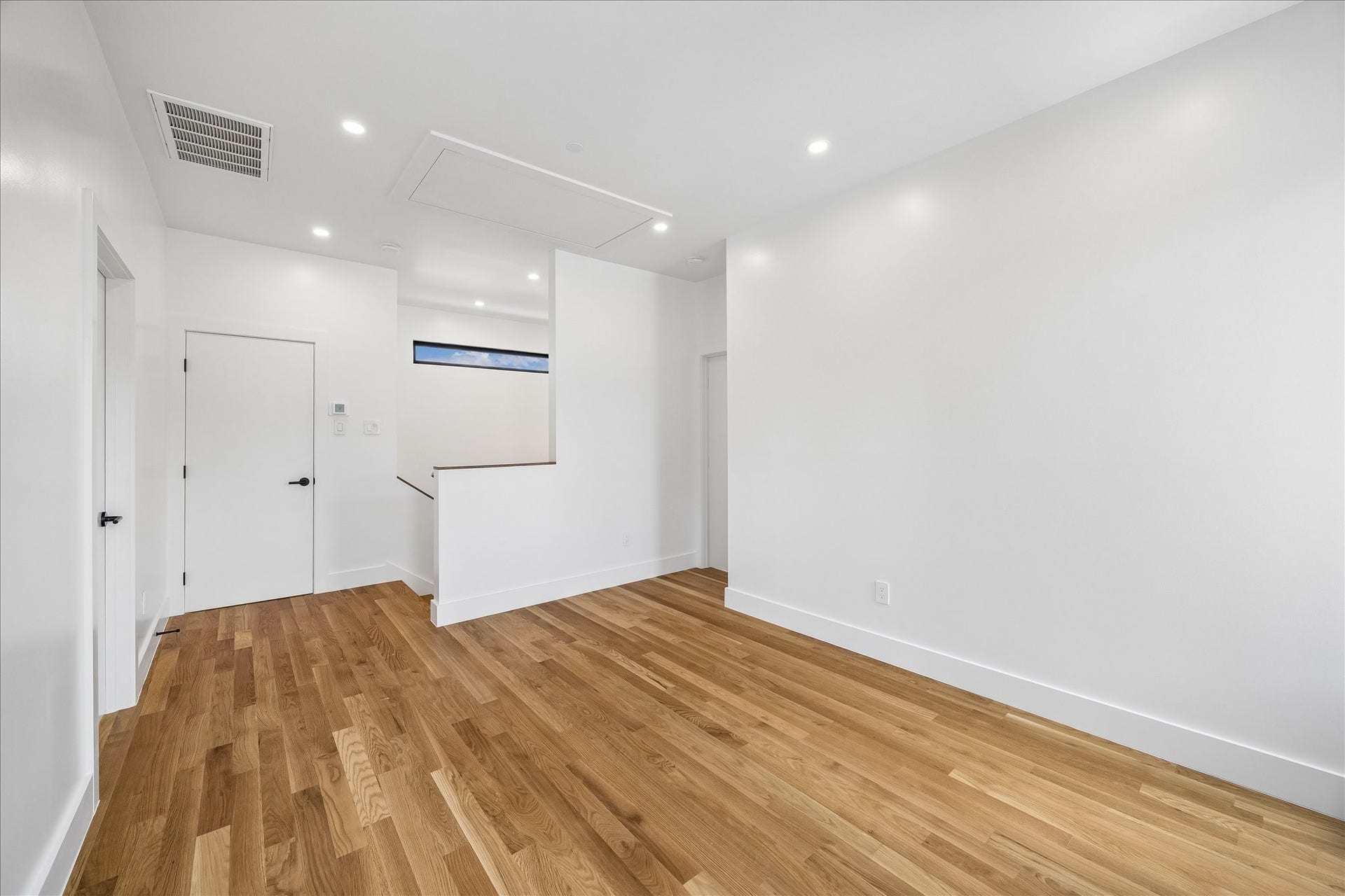 Third-floor family lounge shared by two adjacent bedrooms.
