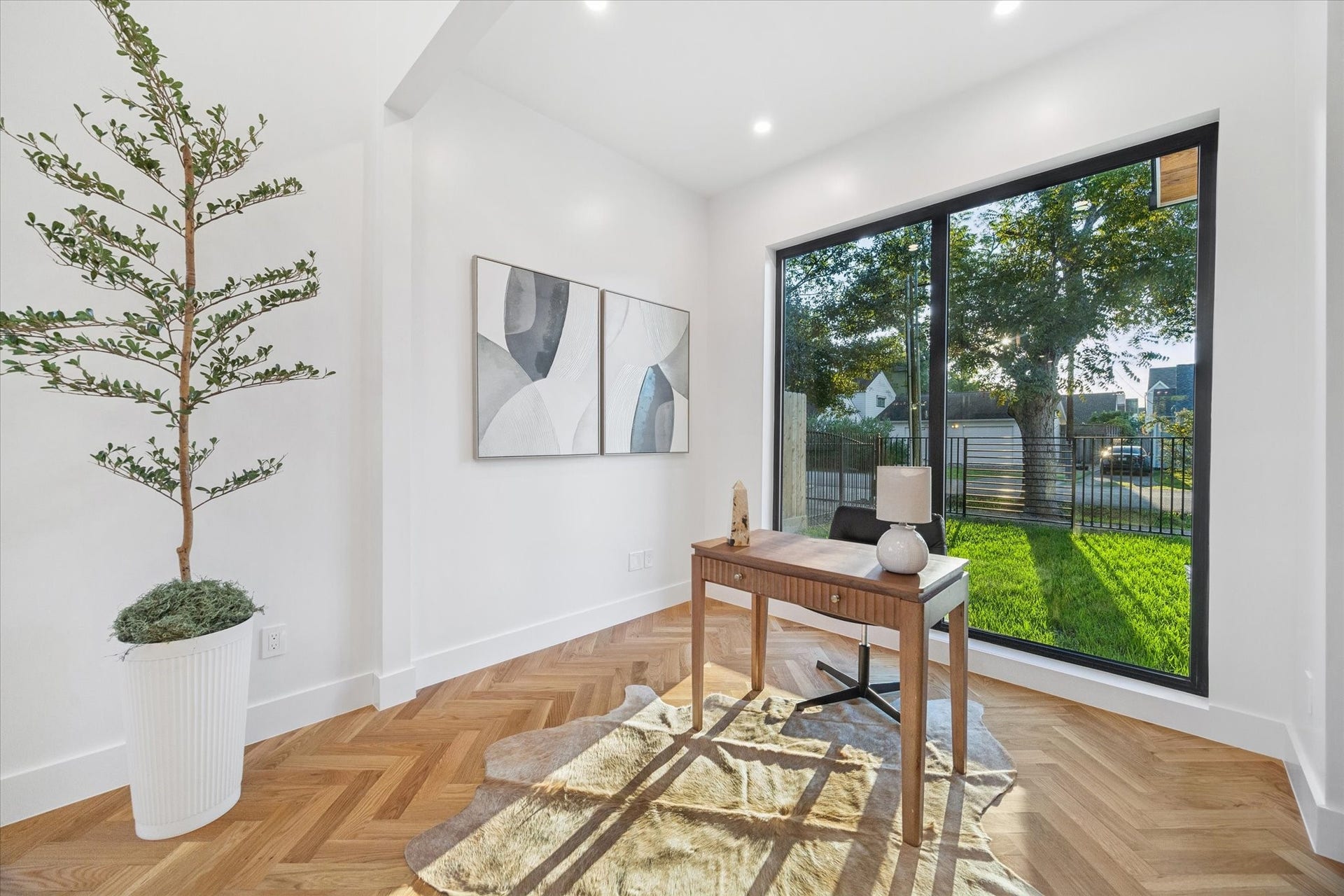 Another view of the open-concept design showing large sliding glass doors leading to the backyard.
