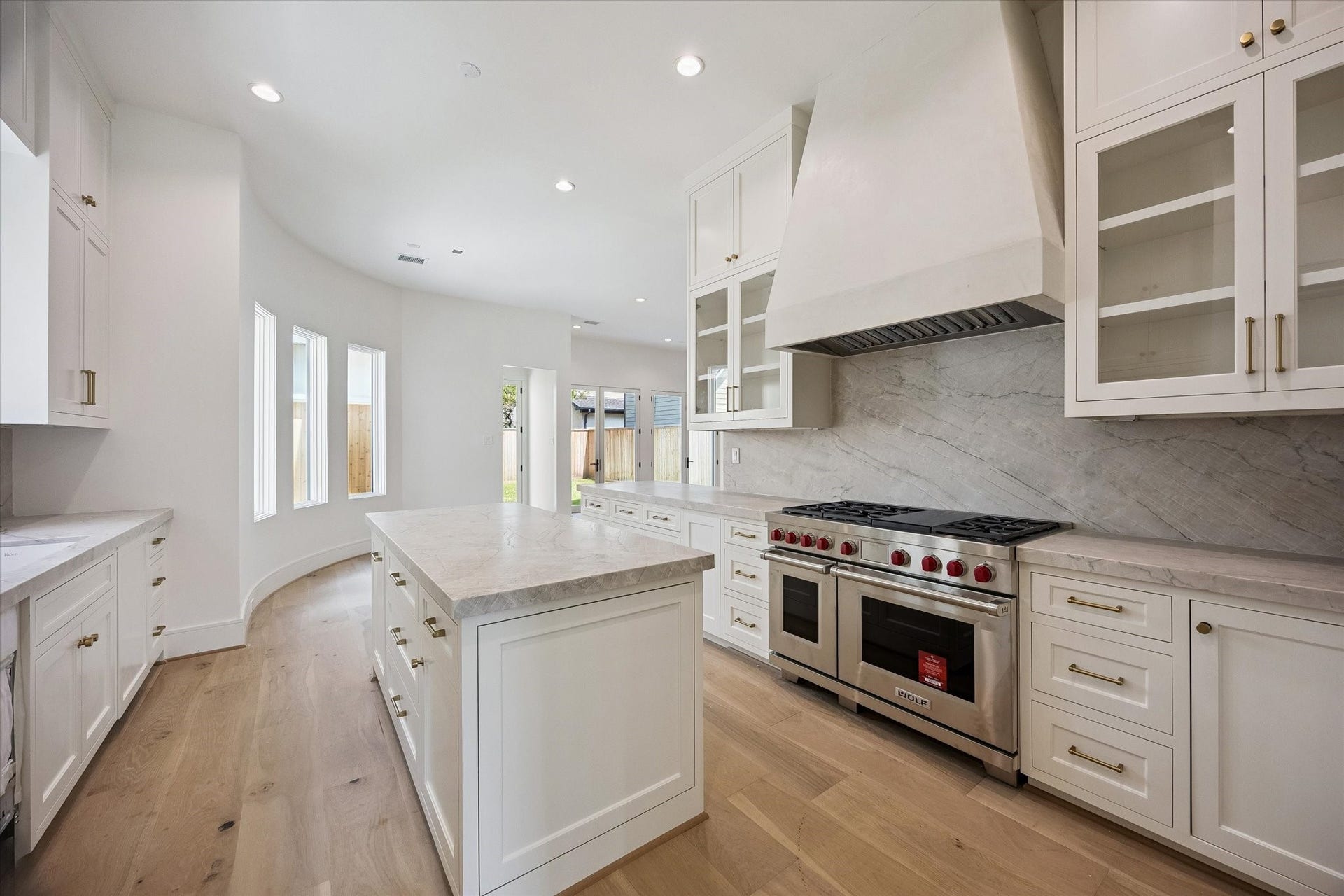 Wolf gas range; SubZero fridge; 2 Cova dishwashers; custom plastered vent hood.