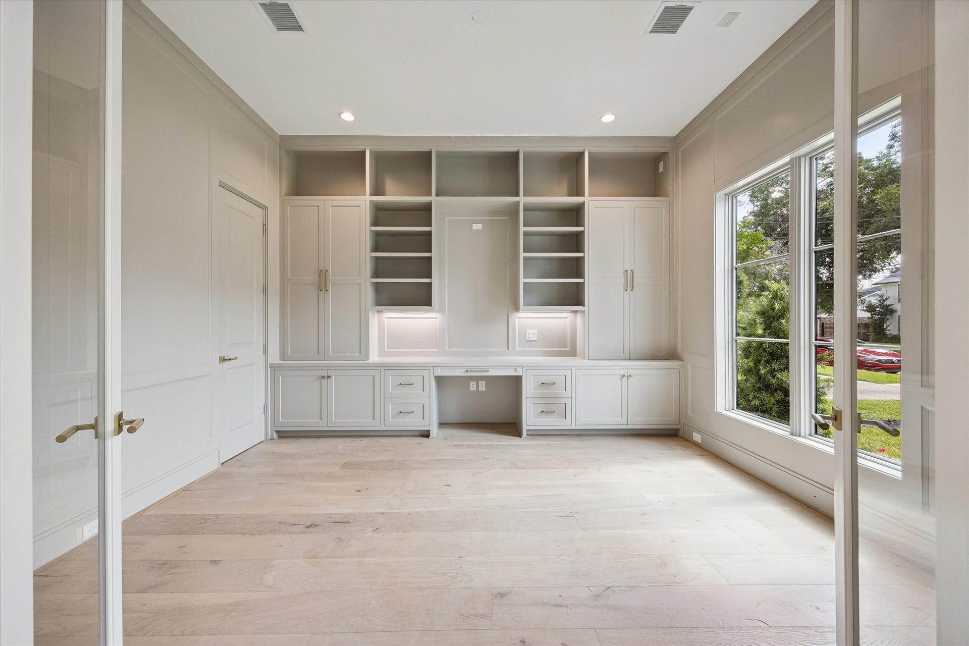Study with large walk-in storage closet.
