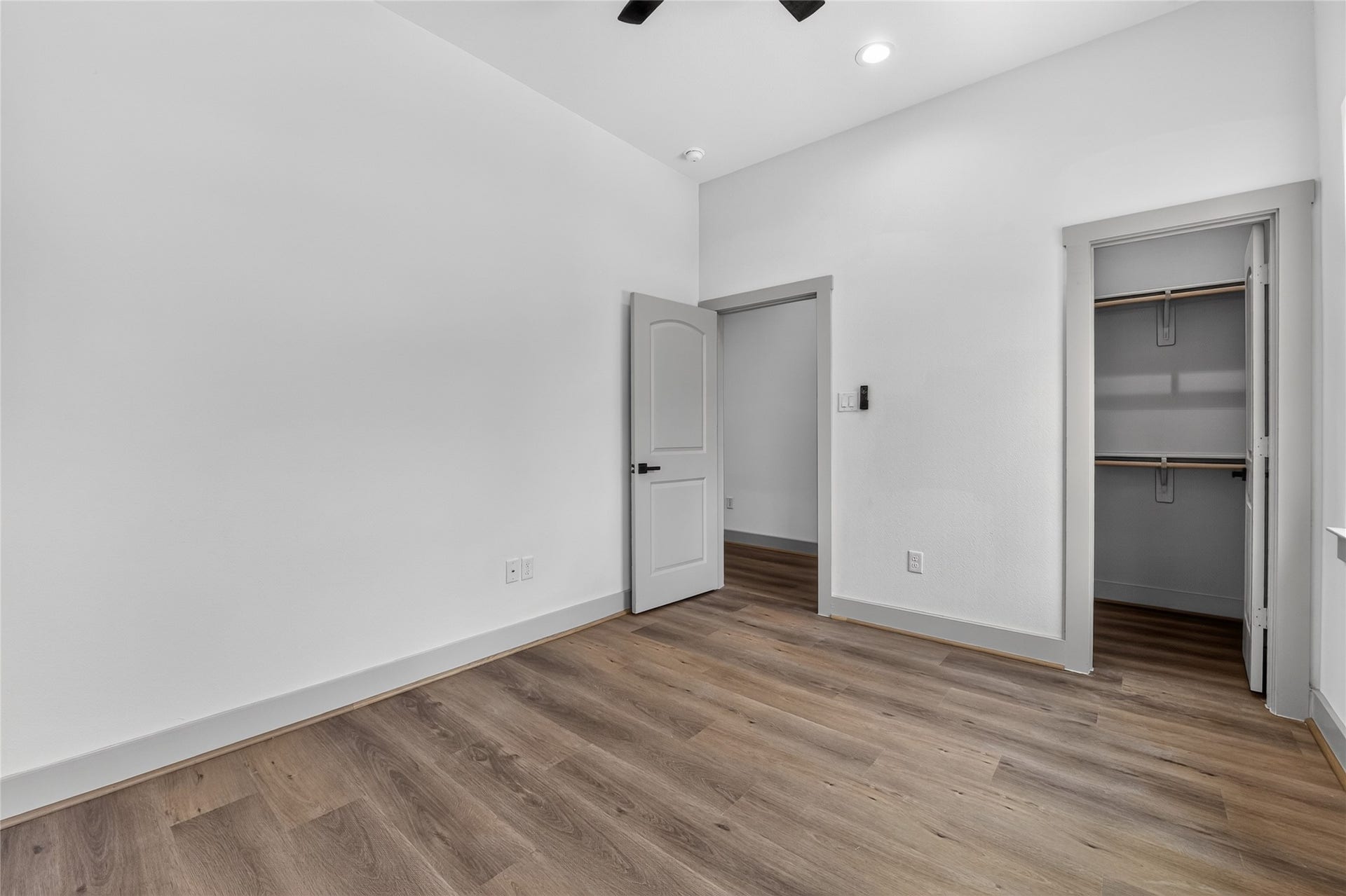 A bright spacious secondary bedroom with a generous closet.