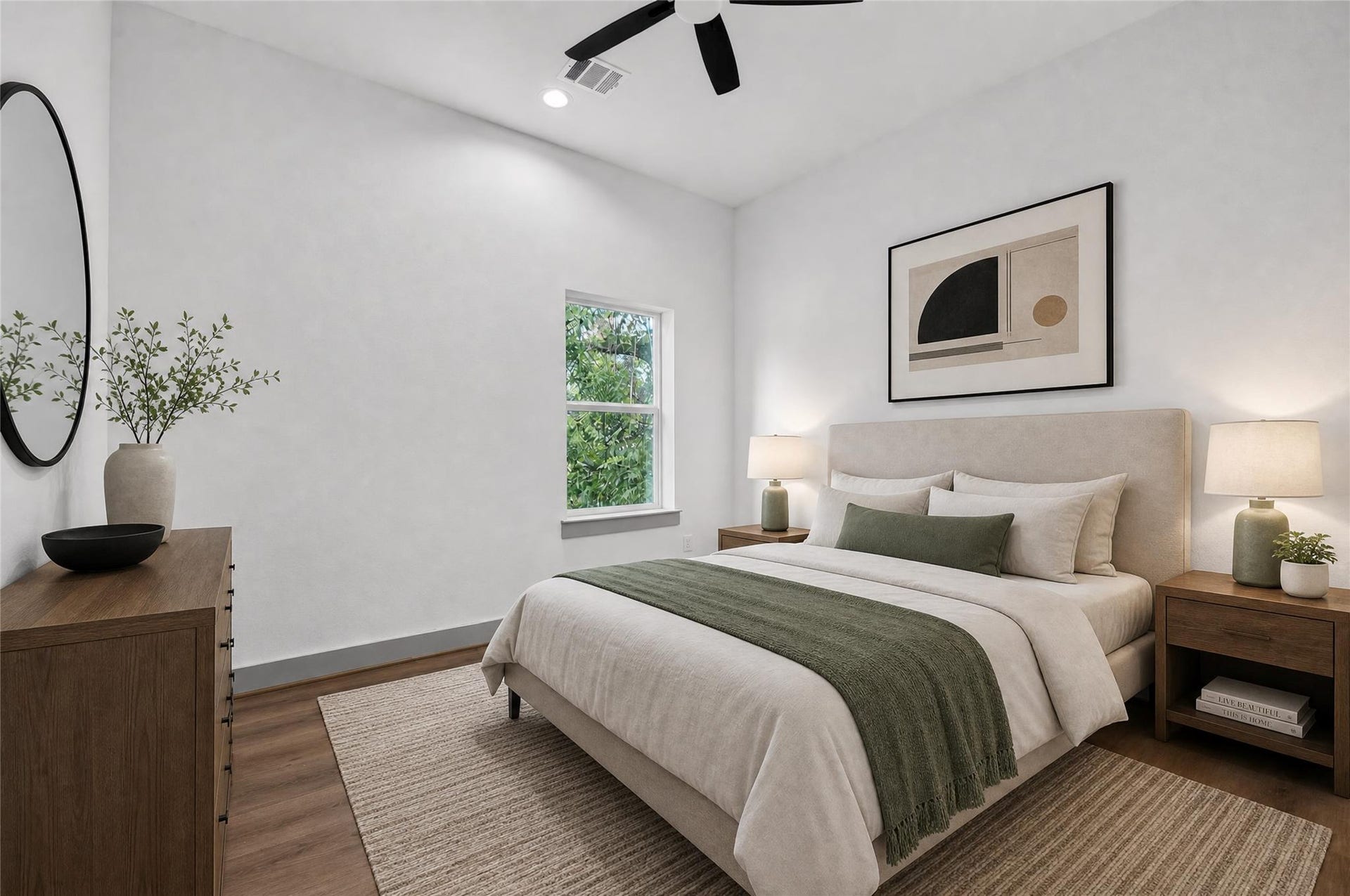 One of two upper-Level bedrooms feature no carpet low maintenance floors and quiet second-story views.
