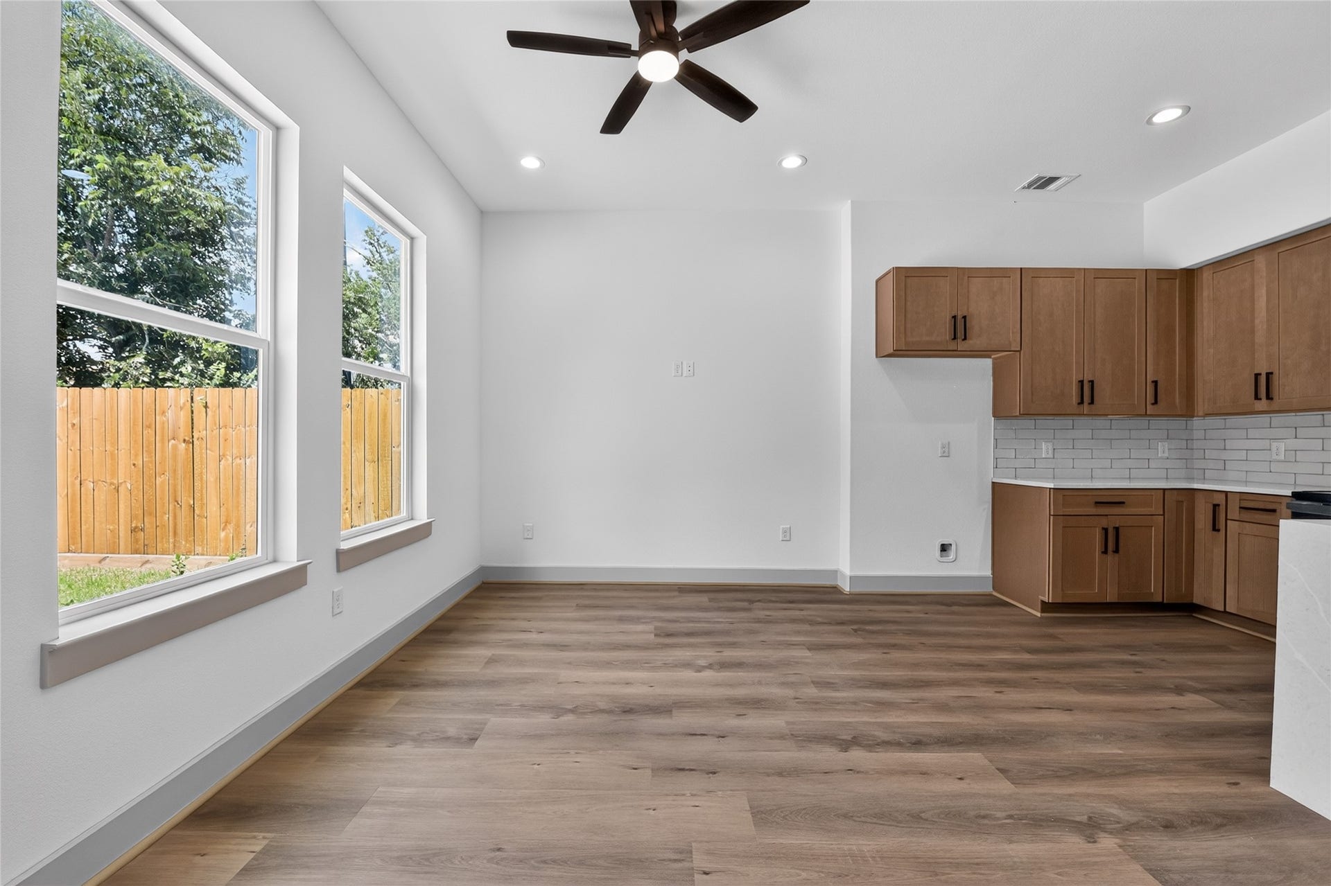 Unrestricted living, airy and modern--the first floor is anchored by sleek, uninterrupted flooring.