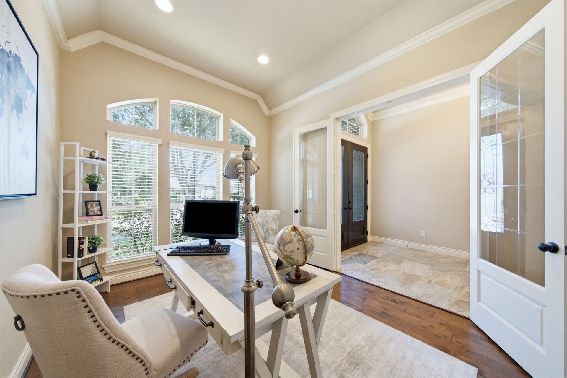 4603 Piper Shadow Lane, Katy, TX 77494 Elegant home office with French doors, abundant natural light from arched windows.