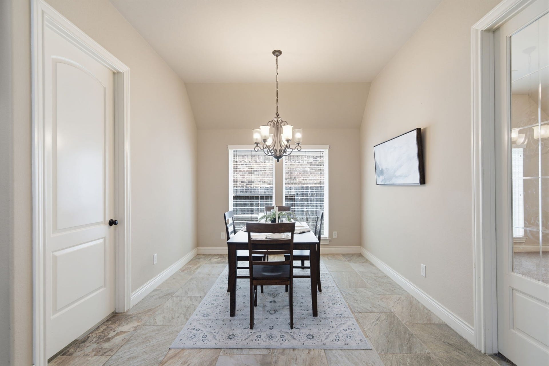 4603 Piper Shadow Lane, Katy, TX 77494 Elegant breakfast area with a high ceiling, featuring a stylish chandelier, neutral tones, and a large window allowing ample natural light.