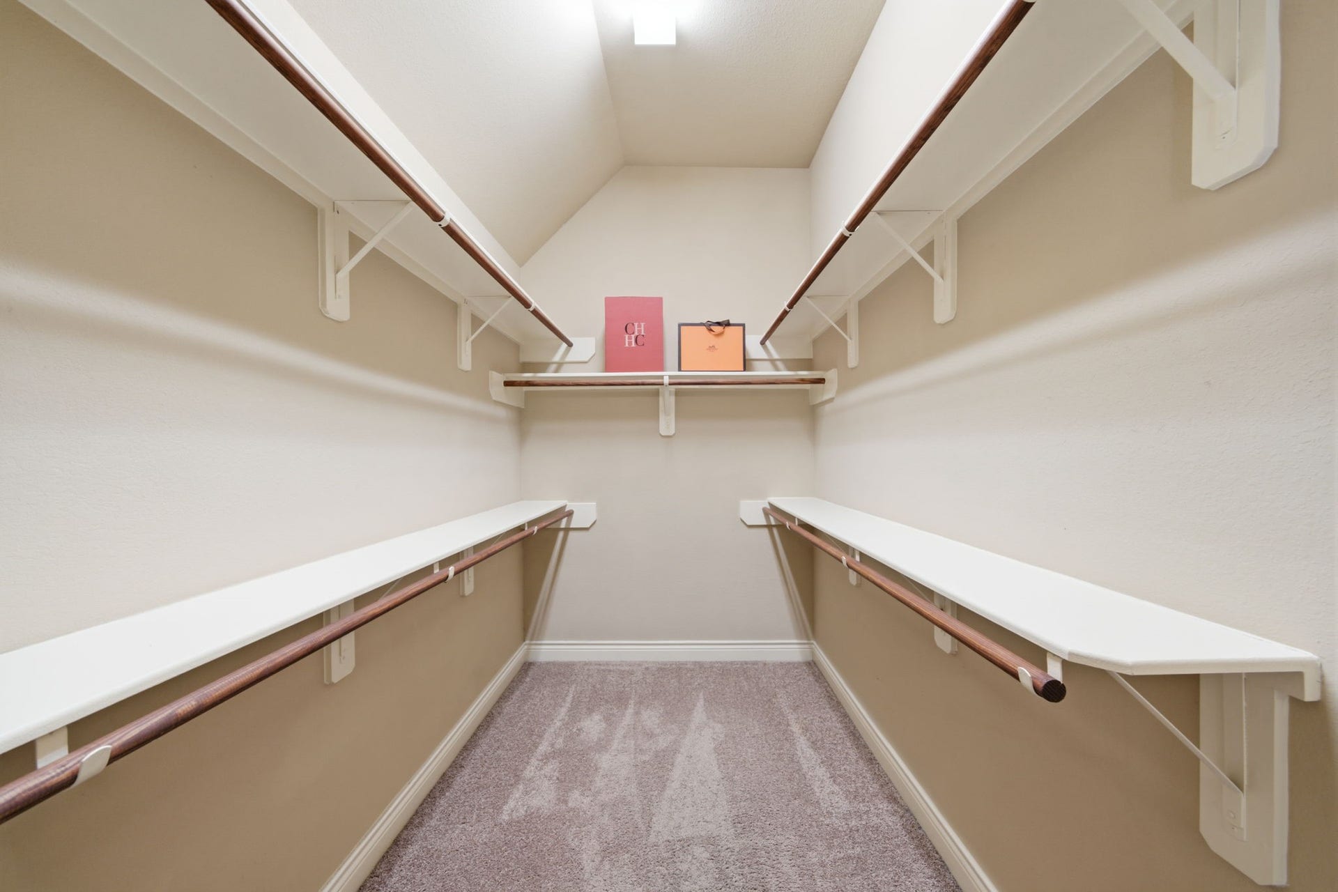 4603 Piper Shadow Lane, Katy, TX 77494 Spacious walk-in closet featuring ample shelving and hanging rods, perfect for organized storage.