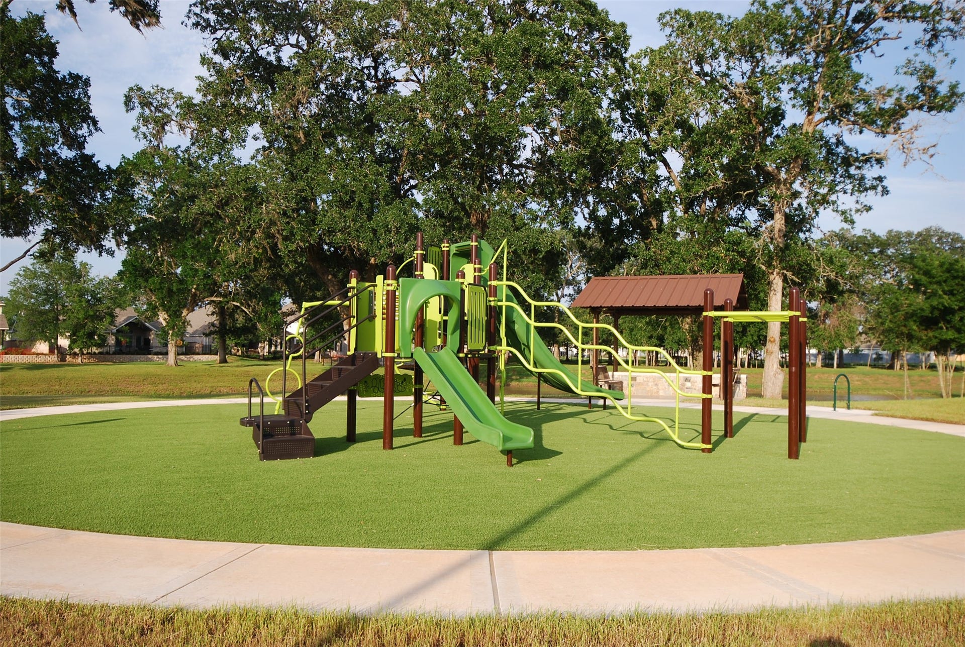 Let the kids laugh, explore, and play at the nearby Playground, conveniently accessed by a lovely walk thru the trees and along the water at the far end of the lake. Just moments away, this family-friendly amenity offers the perfect place for outdoor adventures, after-school fun, and making lasting memories close to home.