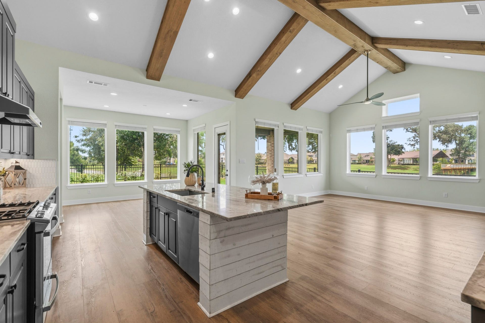 This picture is why you would want to buy this home! And, why you will not find anywhere else in Fulshear Lakes with these stunning 180-degree panorama views of lush landscaping, framed by wrought iron fencing and dramatic views of natural Sheffield Lake that is enhanced by mature trees.