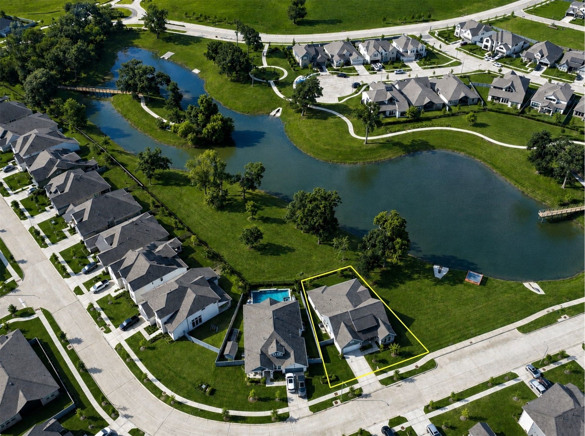 This aerial view showcases why this home offers such a SPECIAL LIFESTYLE.  Not only does it overlook Sheffield Lake and the fishing Pier, it also sides to an open space Reserve, so NO NEIGHBOR on the right or backyard either; providing both EXTRAORINARY views and near total PRIVACY.