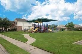 2910 Orchid Ranch Drive, Katy, TX 77494 Charming neighborhood with a spacious playground, perfect for families.