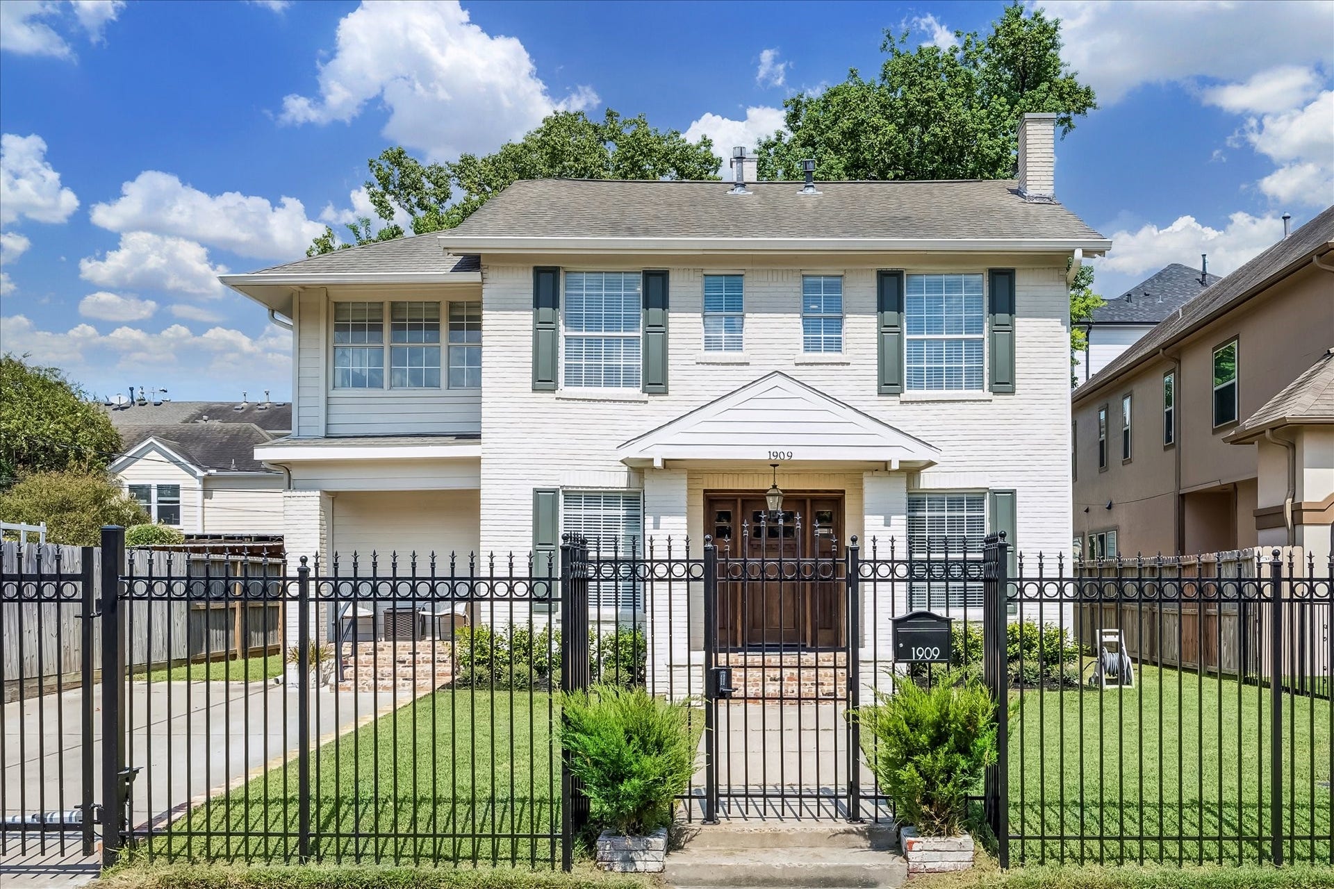 1909 Rosewood Street, Houston, TX 77004 Classic 1938 architecture in the Rice/Museum District pairs with a German slurry exterior, 2026 shutters, and a freshly repainted wrought iron fence for a polished first impression.