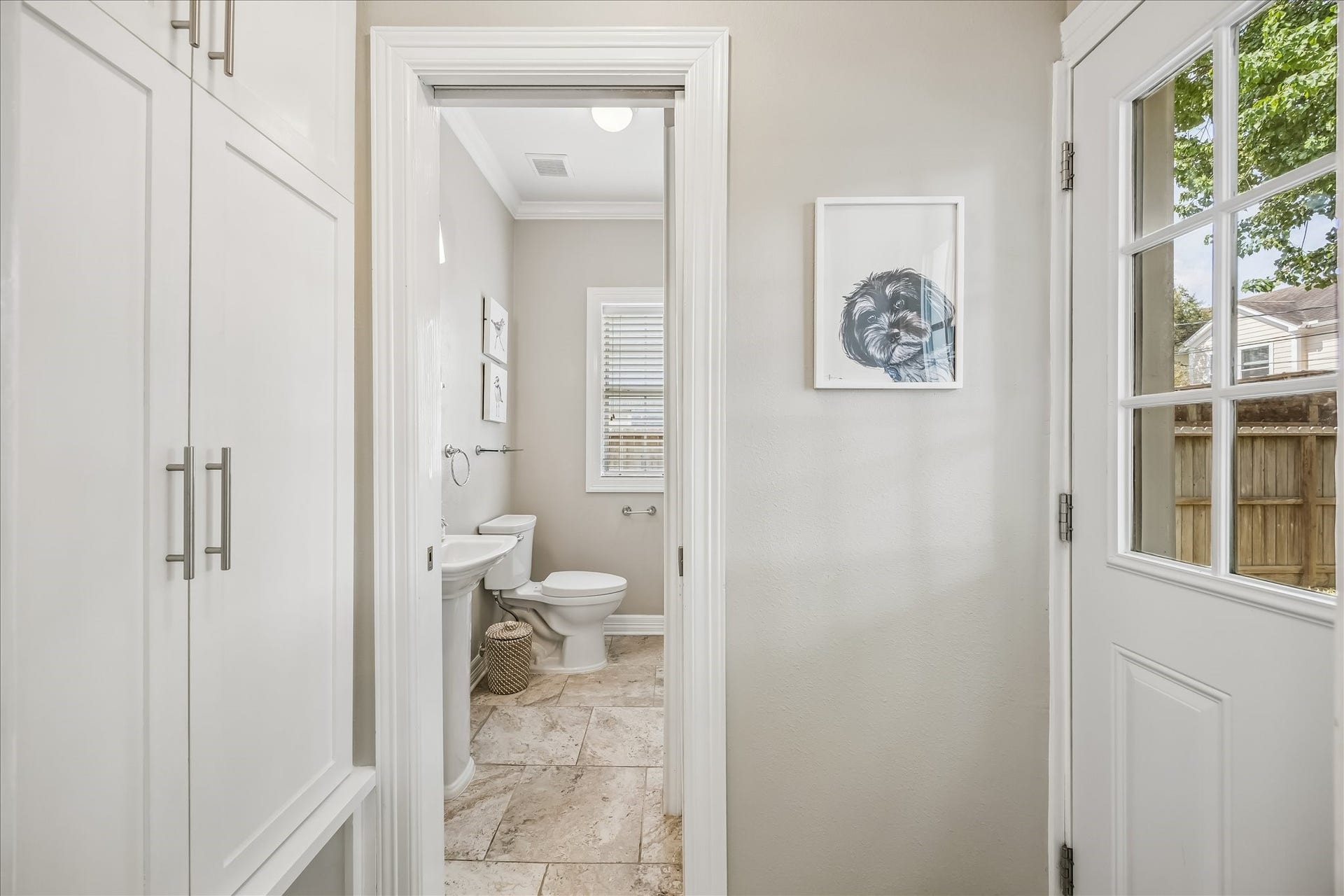 1909 Rosewood Street, Houston, TX 77004 Built-in cabinetry adds useful concealed storage along the hall while keeping the adjoining spaces clean and uncluttered.