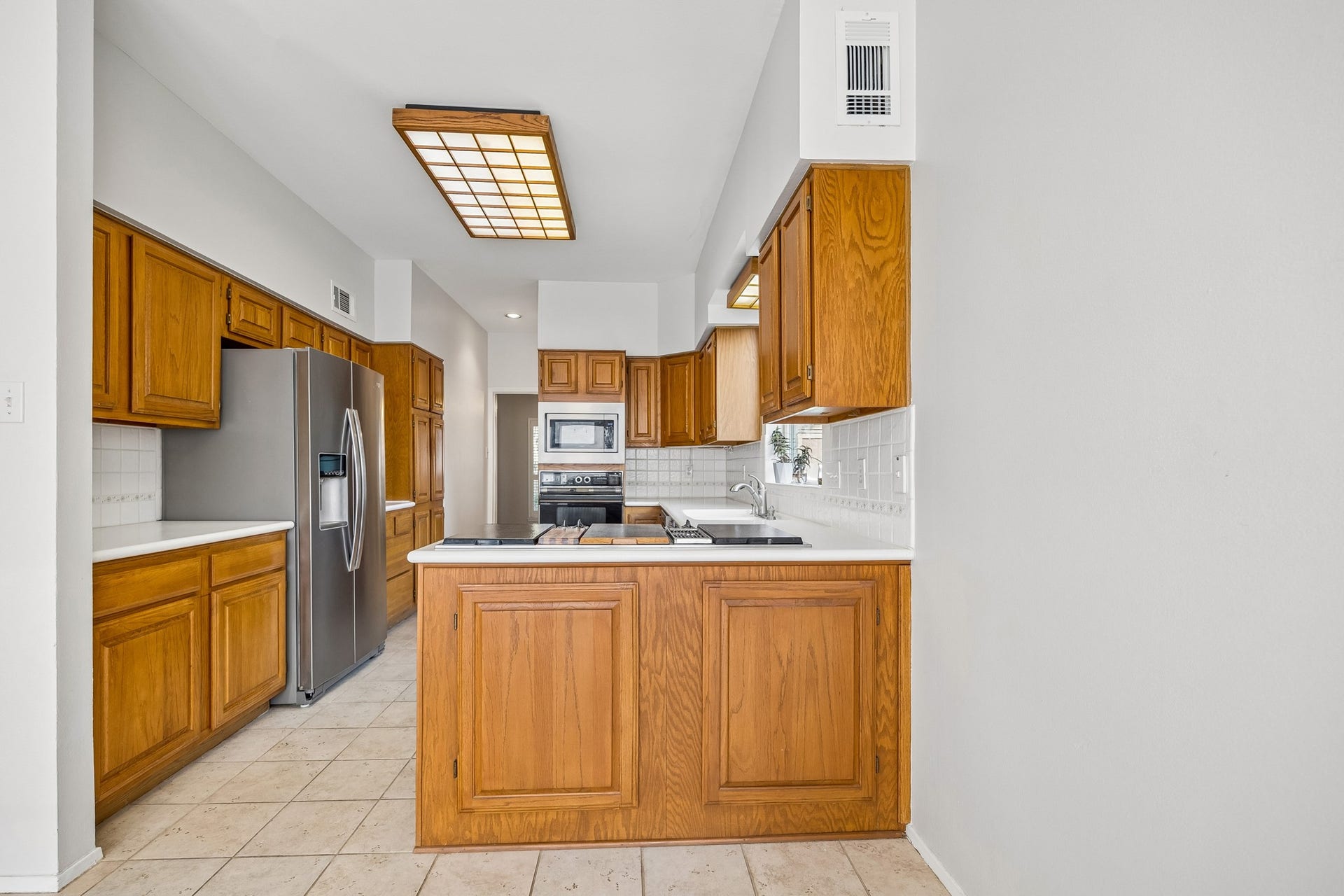 3902 Crystal Falls Drive, Missouri City, TX 77459 Functional kitchen with ample cabinetry and generous counter space.