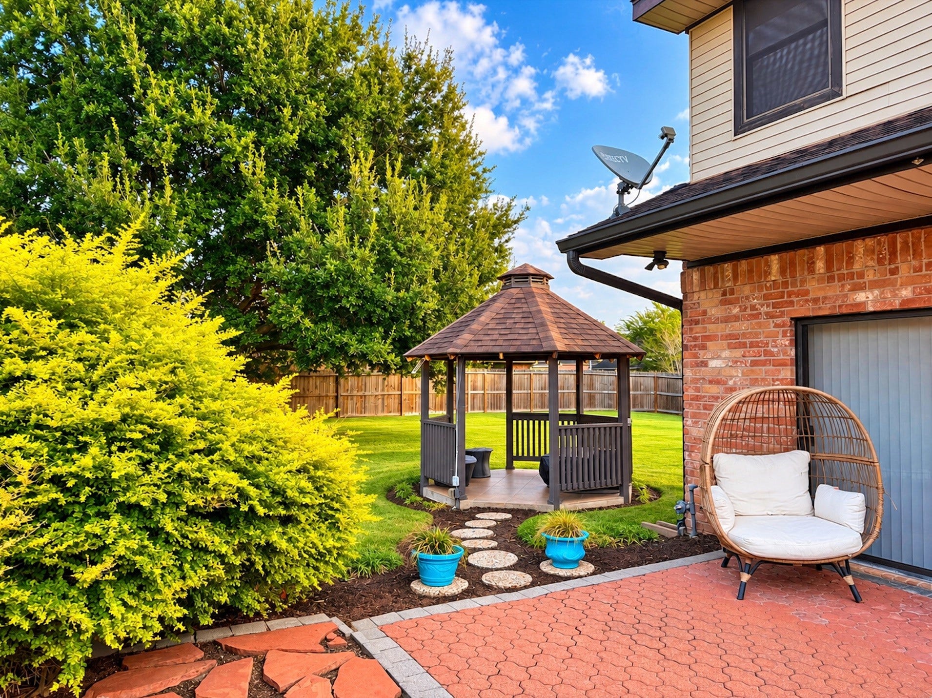 3902 Crystal Falls Drive, Missouri City, TX 77459 Inviting backyard retreat with covered gazebo, lush landscaping, manicured lawn, paver patio, and charming stepping-stone walkway.
*Virtually enhanced photo