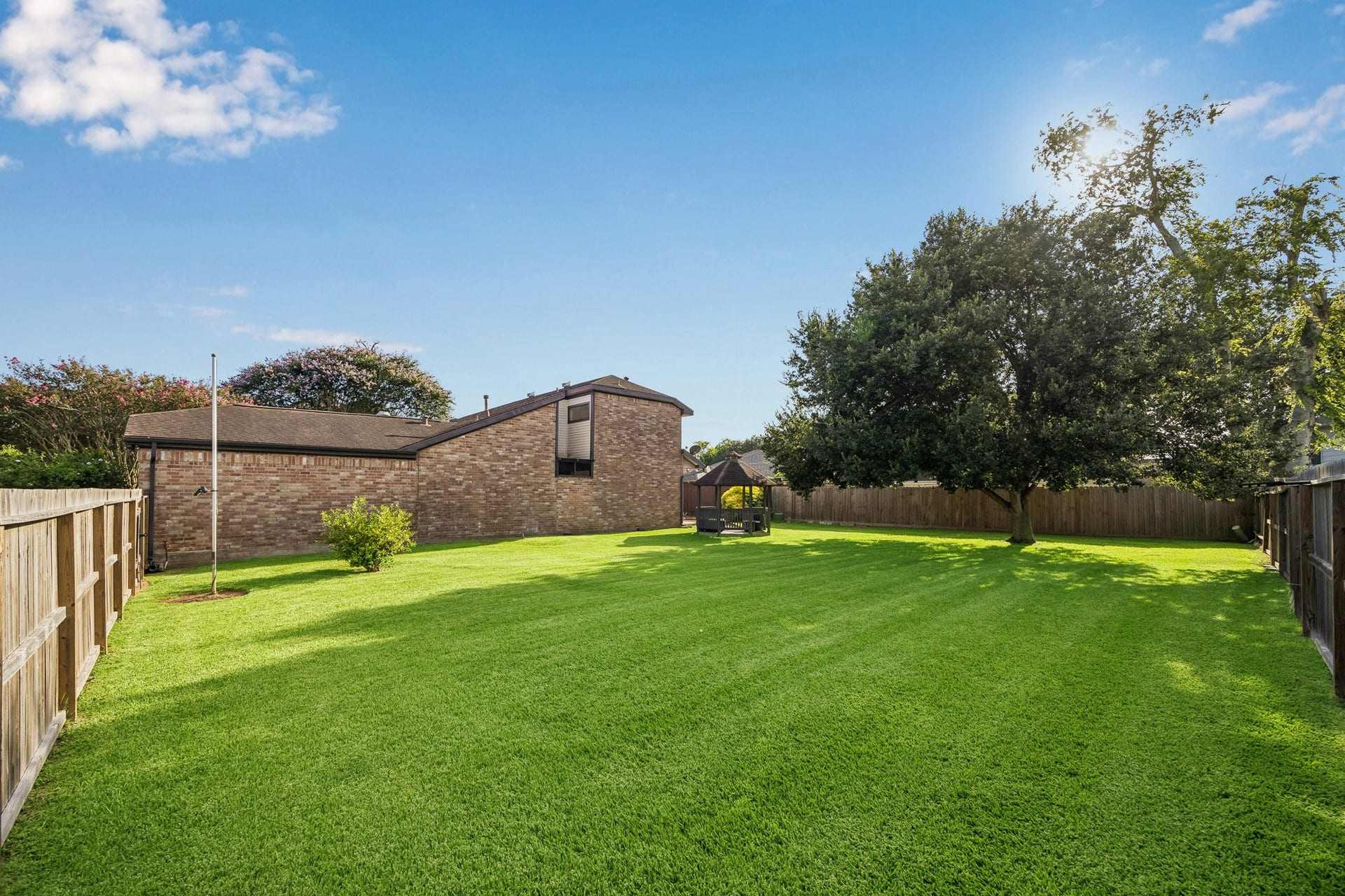 3902 Crystal Falls Drive, Missouri City, TX 77459 Private backyard with generous green space for pets and play.