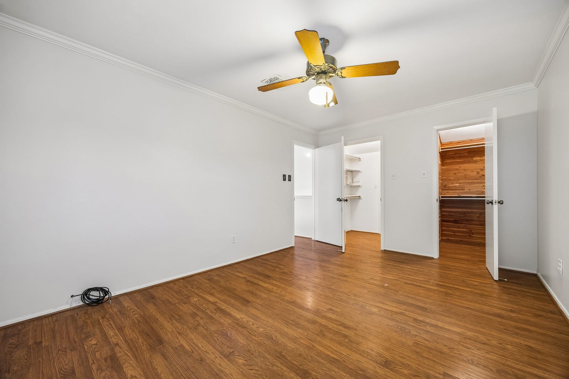 3902 Crystal Falls Drive, Missouri City, TX 77459 Secondary bedroom featuring an oversized closet and cedar storage closet.