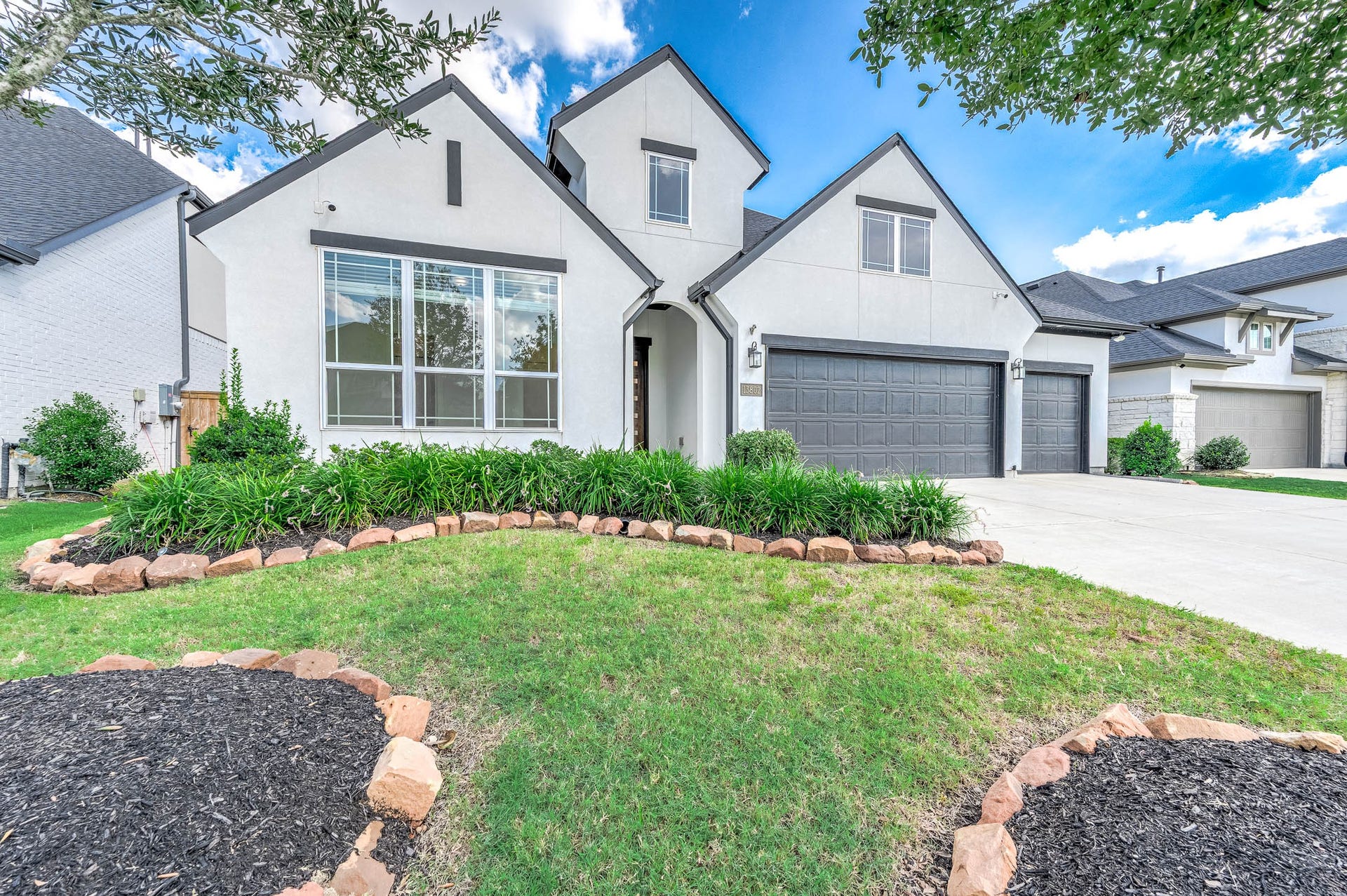 13802 Arroyo Grande Drive, Cypress, TX 77433 Gorgeous curb appeal with manicured landscaping and a welcoming front elevation.