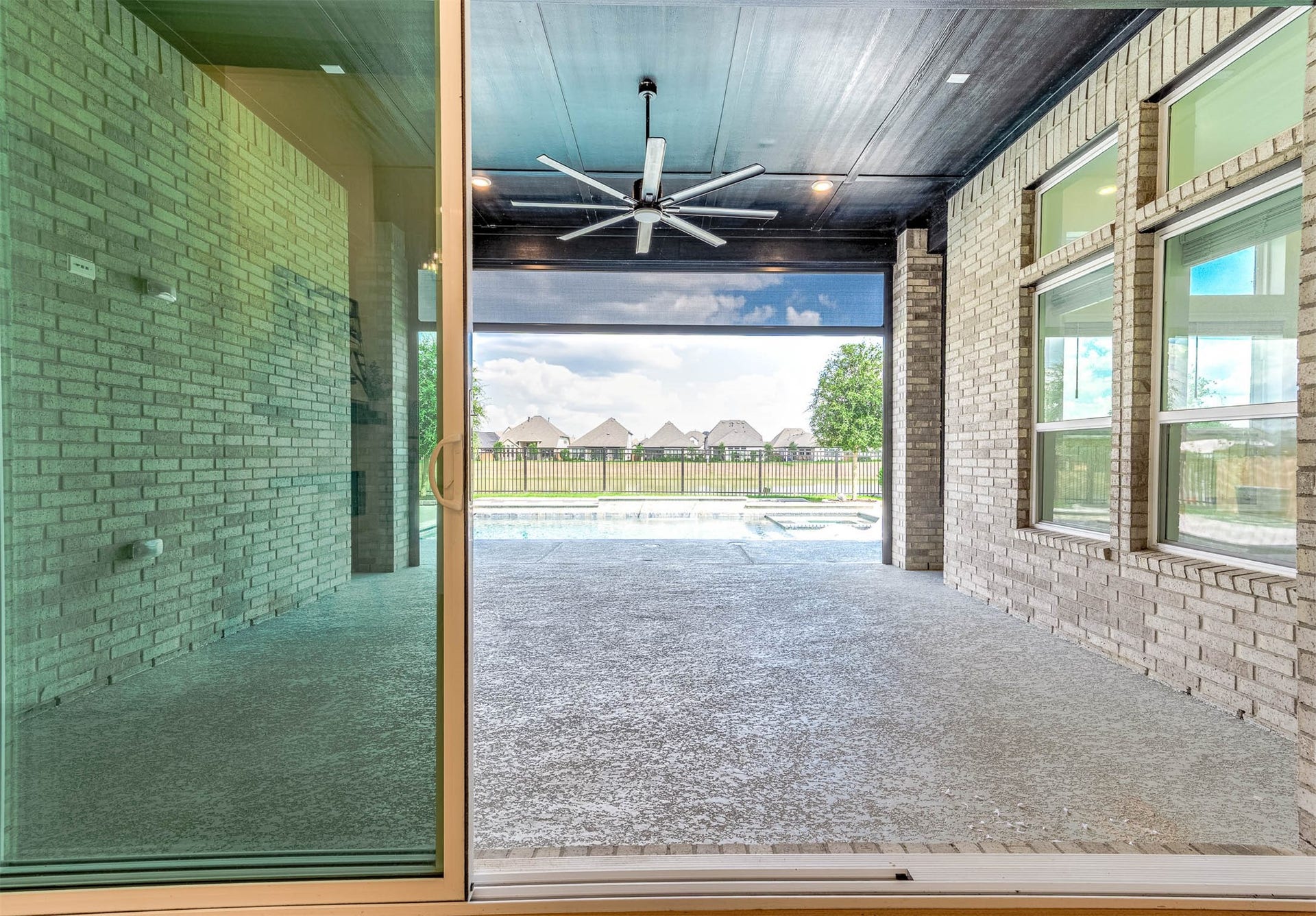 13802 Arroyo Grande Drive, Cypress, TX 77433 Expansive covered patio featuring retractable power screens for year-round enjoyment.