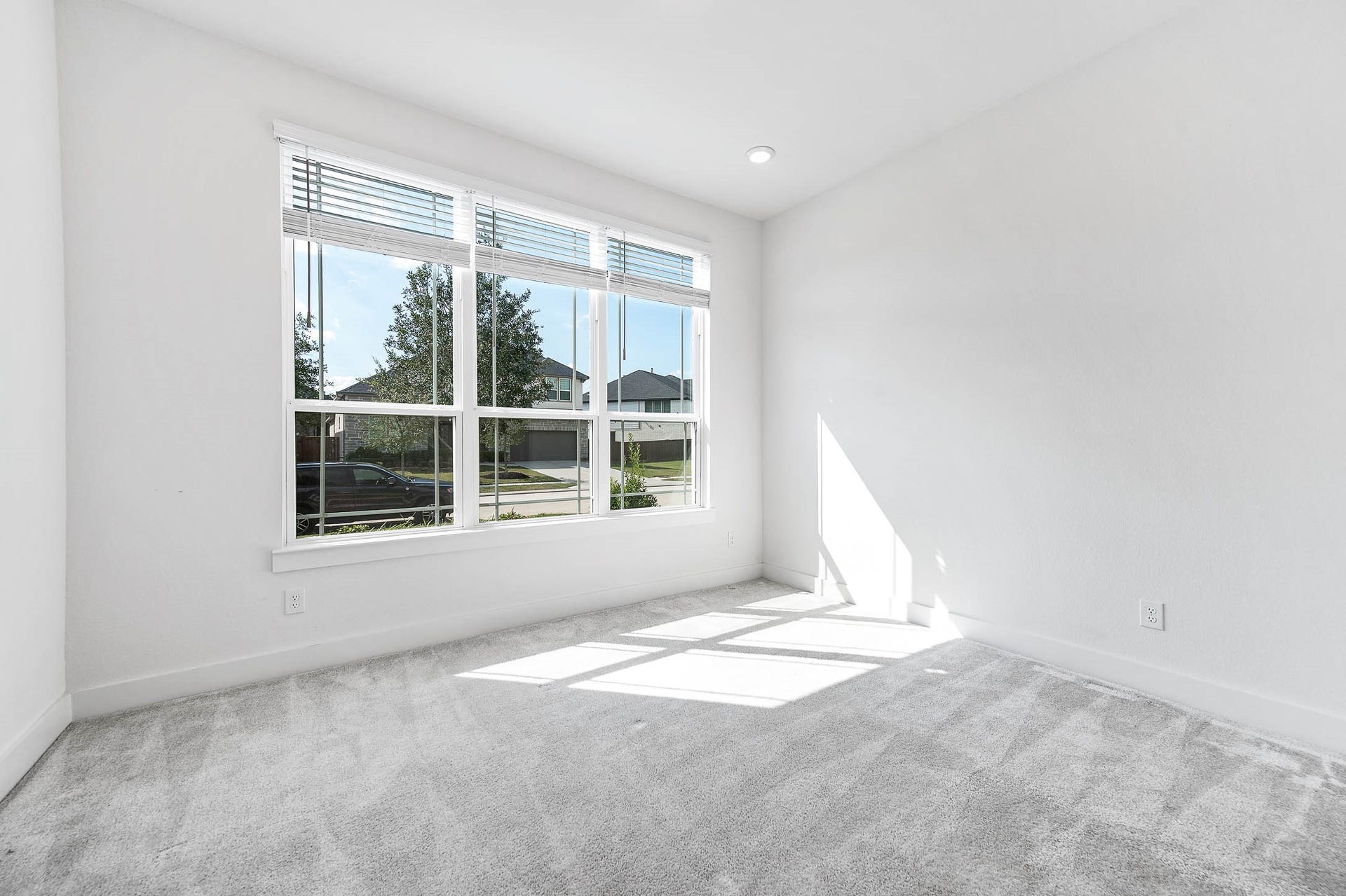 13802 Arroyo Grande Drive, Cypress, TX 77433 Bright secondary bedroom featuring soft carpeting and natural light.