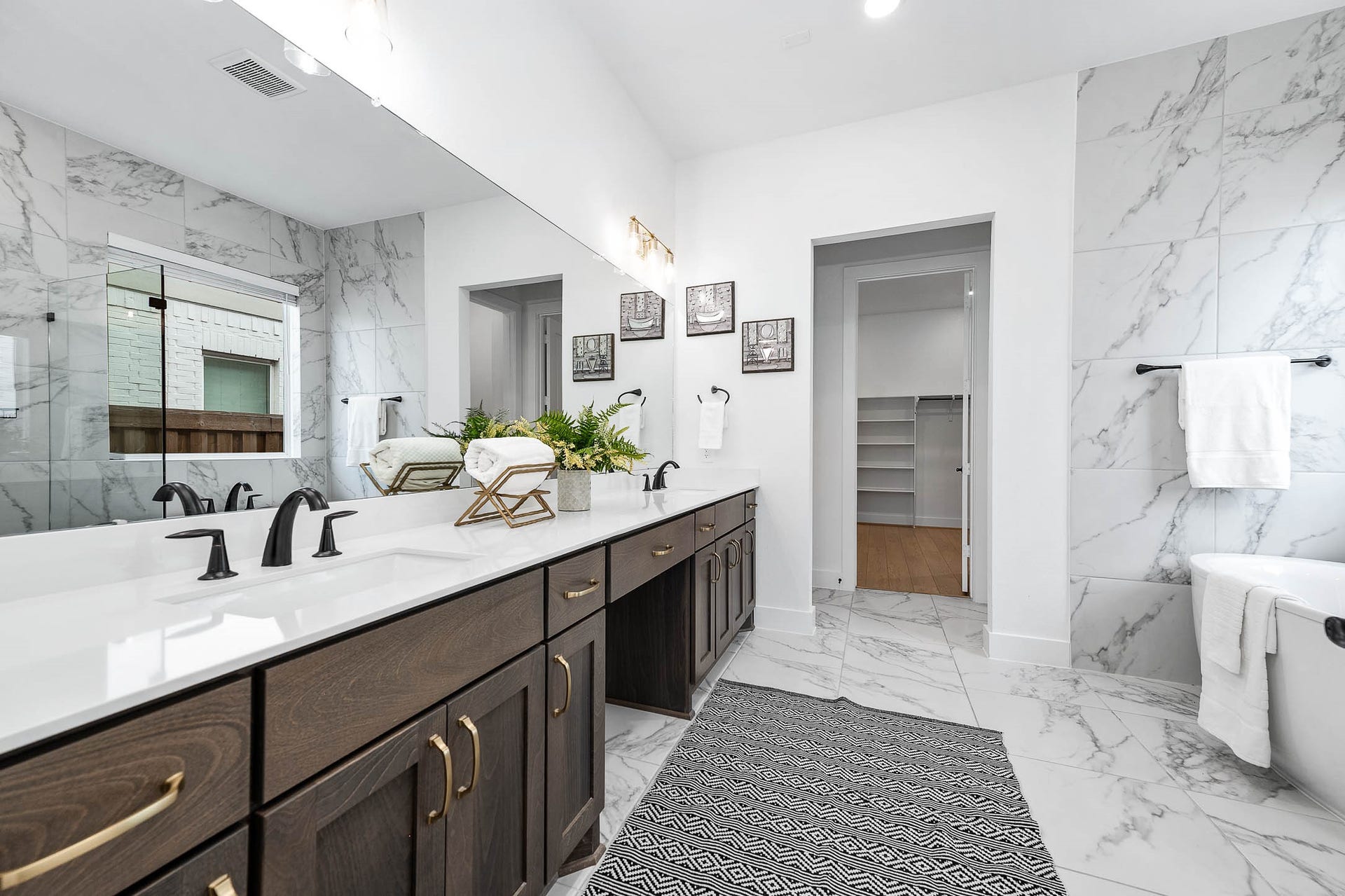 13802 Arroyo Grande Drive, Cypress, TX 77433 Luxurious primary bathroom featuring dual vanities and a spacious walk-in shower.