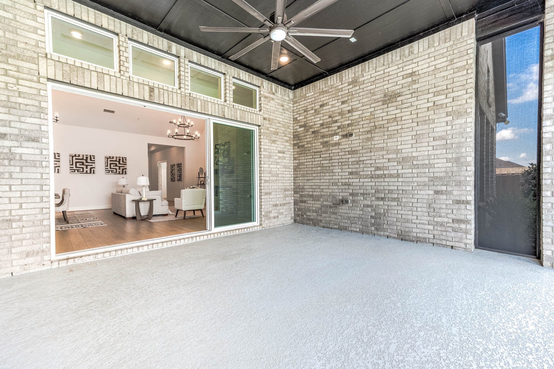13802 Arroyo Grande Drive, Cypress, TX 77433 Seamless indoor-outdoor living with expansive sliding glass doors.