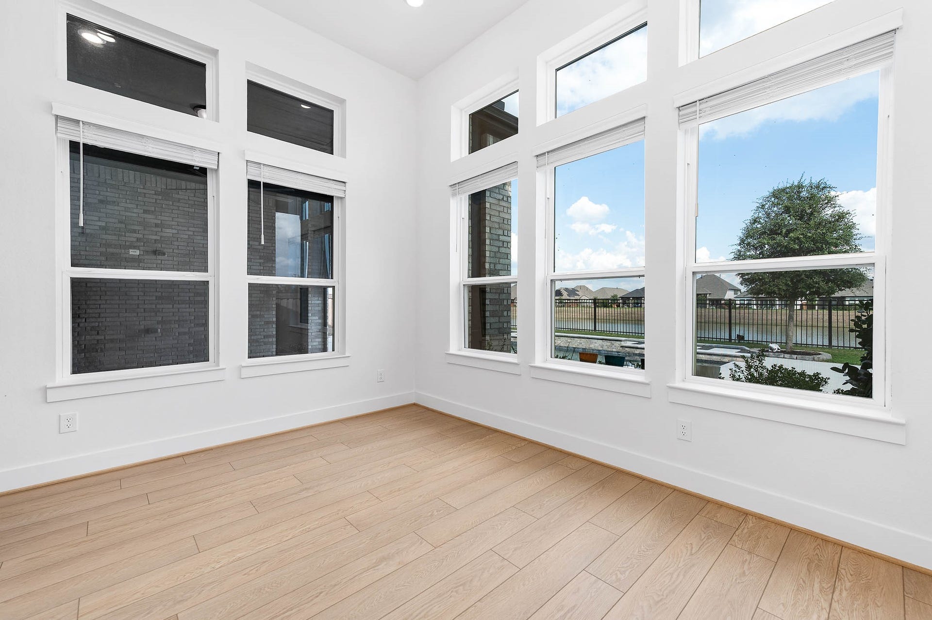 13802 Arroyo Grande Drive, Cypress, TX 77433 Bright sunroom featuring expansive windows overlooking the backyard.