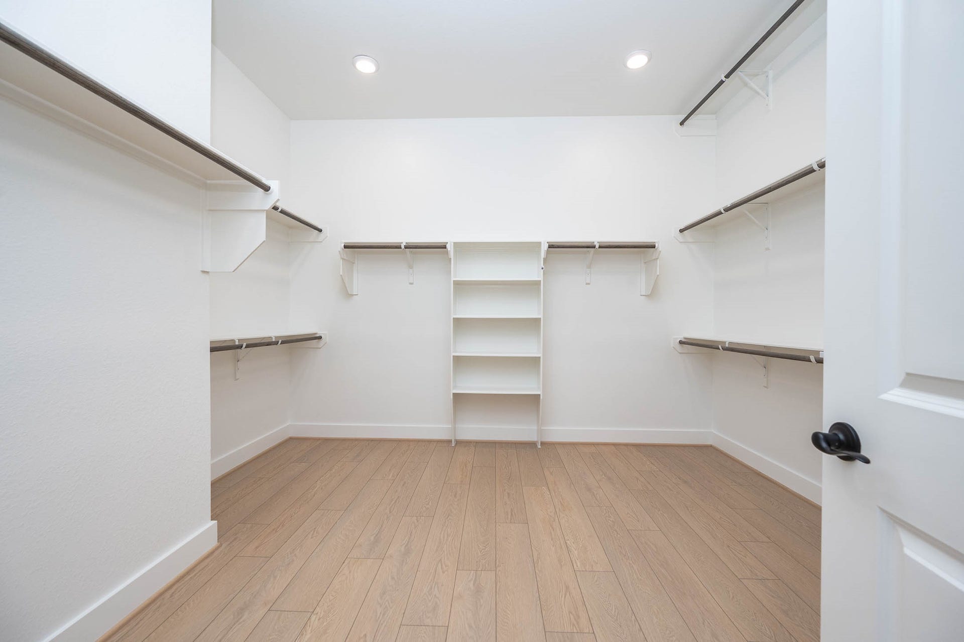 13802 Arroyo Grande Drive, Cypress, TX 77433 Spacious primary walk-in closet with built-in shelving and hanging space.