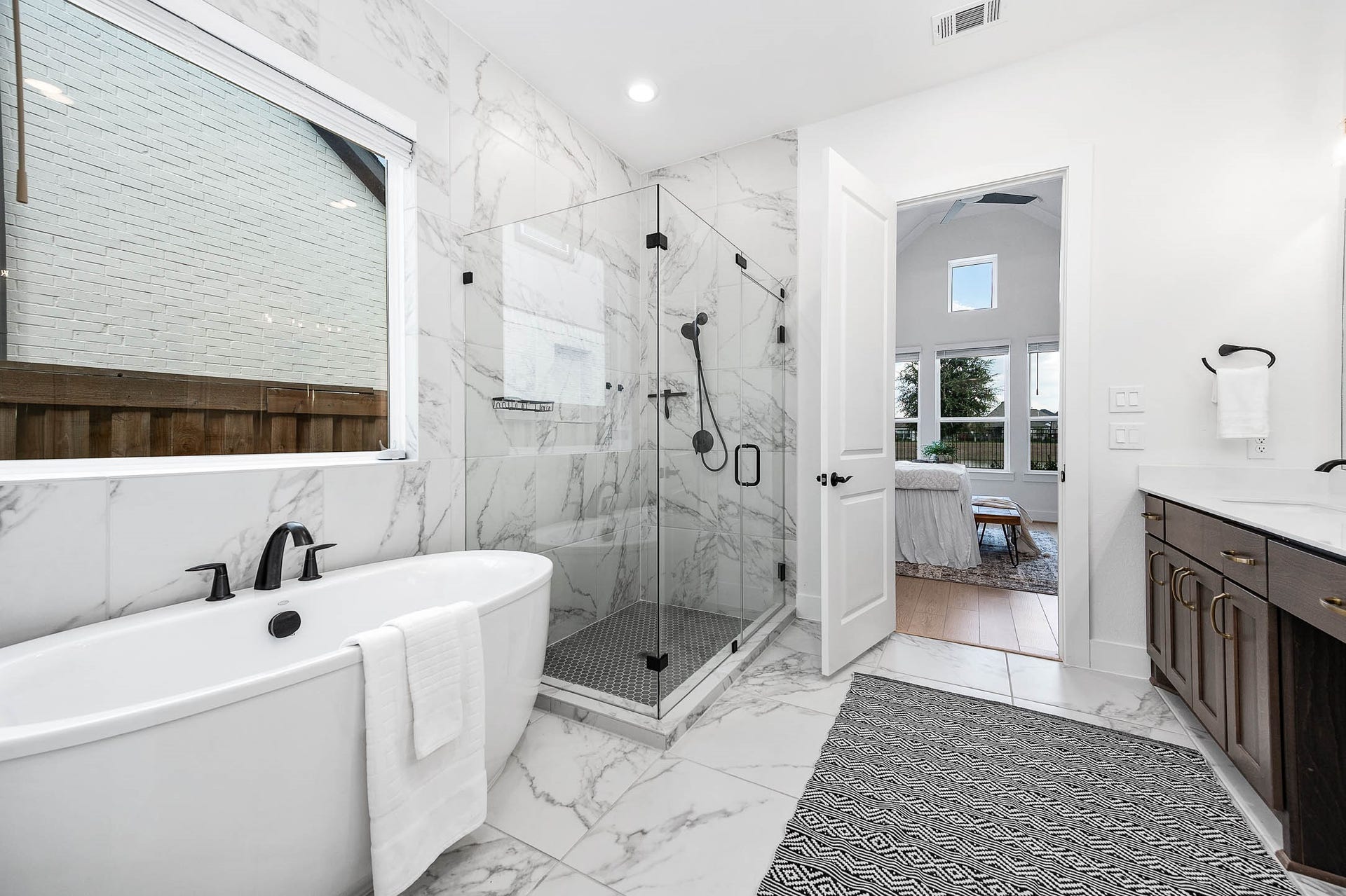 13802 Arroyo Grande Drive, Cypress, TX 77433 Spa-inspired primary bath with a freestanding soaking tub and separate shower.
