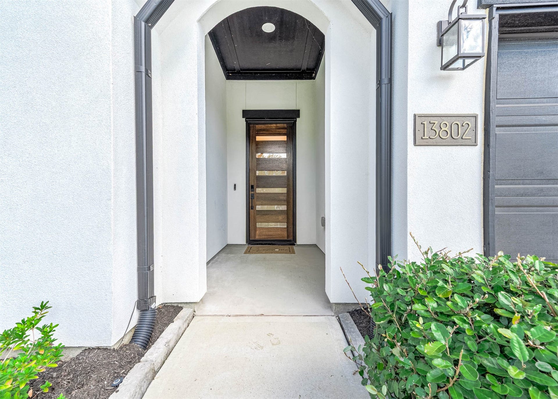 13802 Arroyo Grande Drive, Cypress, TX 77433 Inviting covered entryway with elegant architectural details.