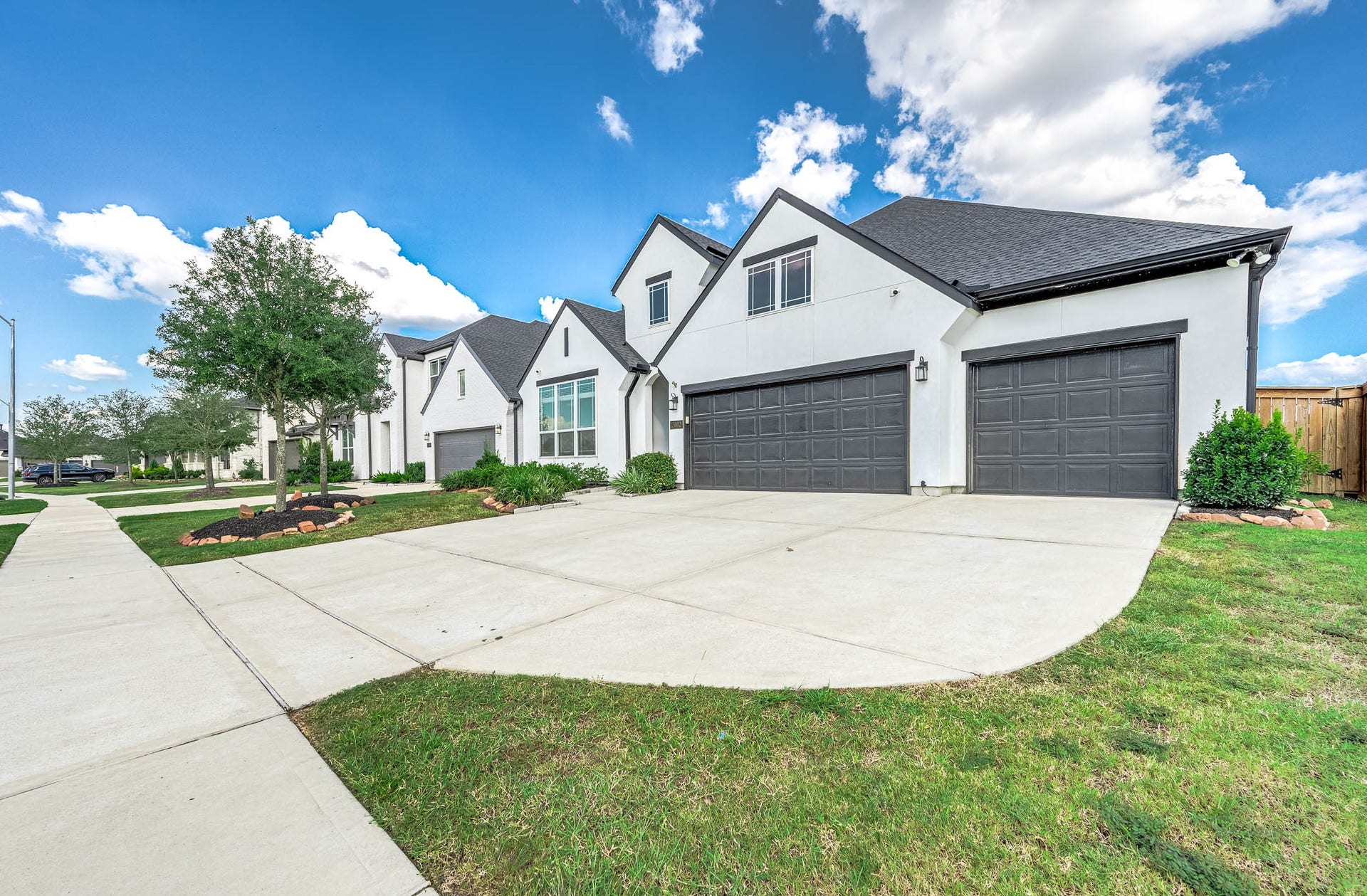 13802 Arroyo Grande Drive, Cypress, TX 77433 Attractive exterior with a three-car garage and beautifully maintained landscaping.