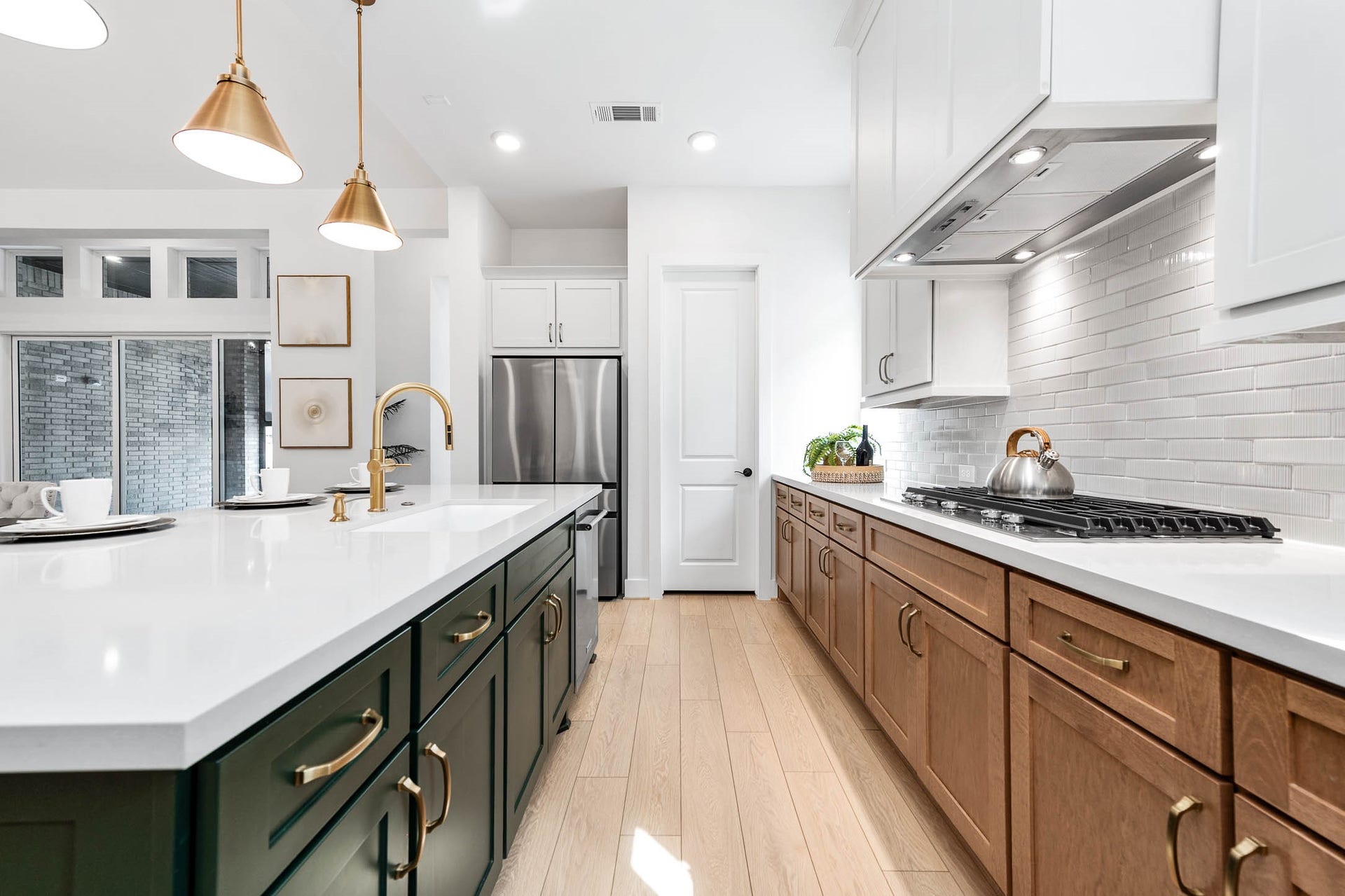 13802 Arroyo Grande Drive, Cypress, TX 77433 Stunning kitchen featuring warm wood cabinetry and modern design elements.