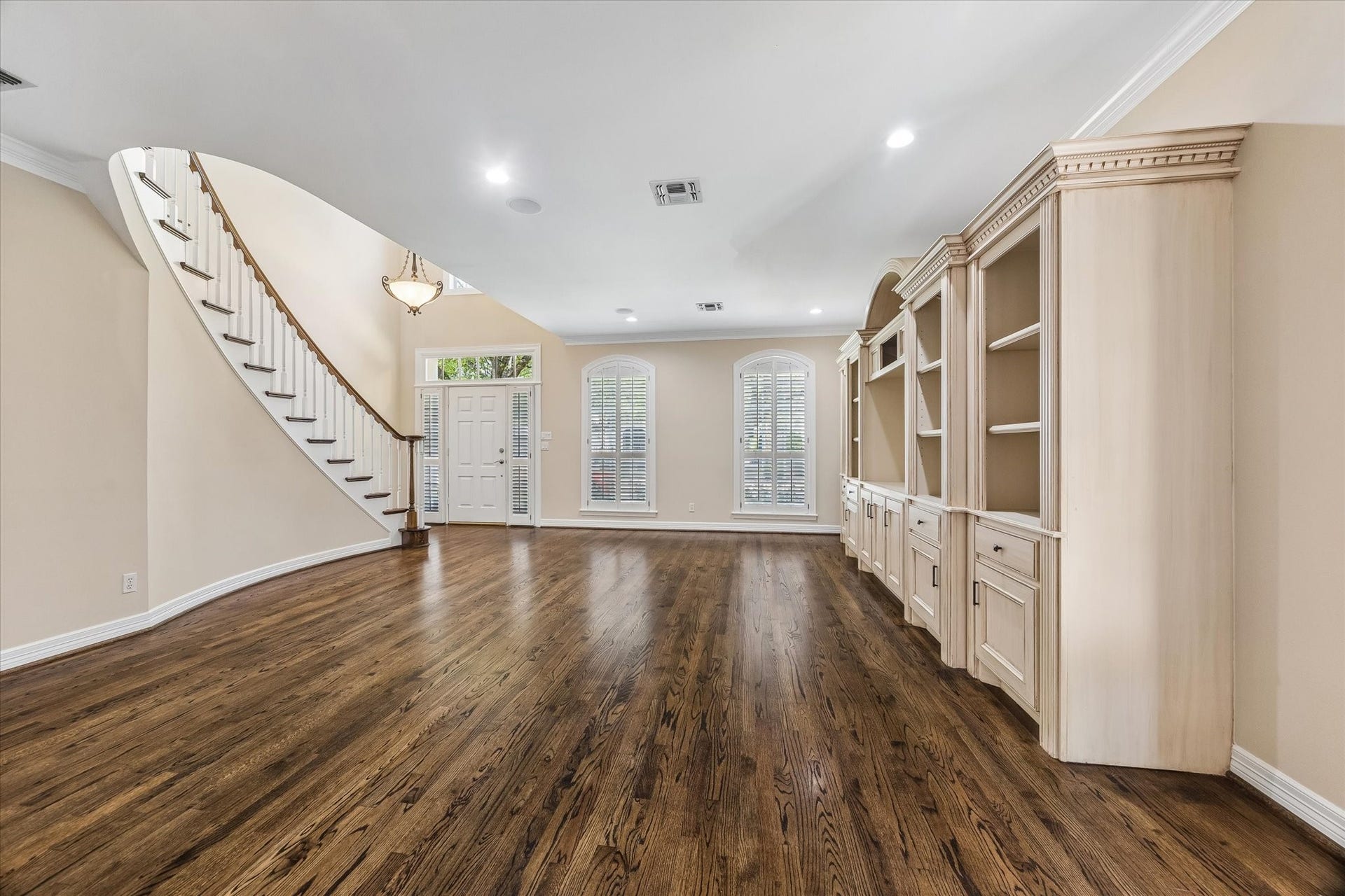 1613 Norfolk Street, Houston, TX 77006 Family room with built-in cabinetry.