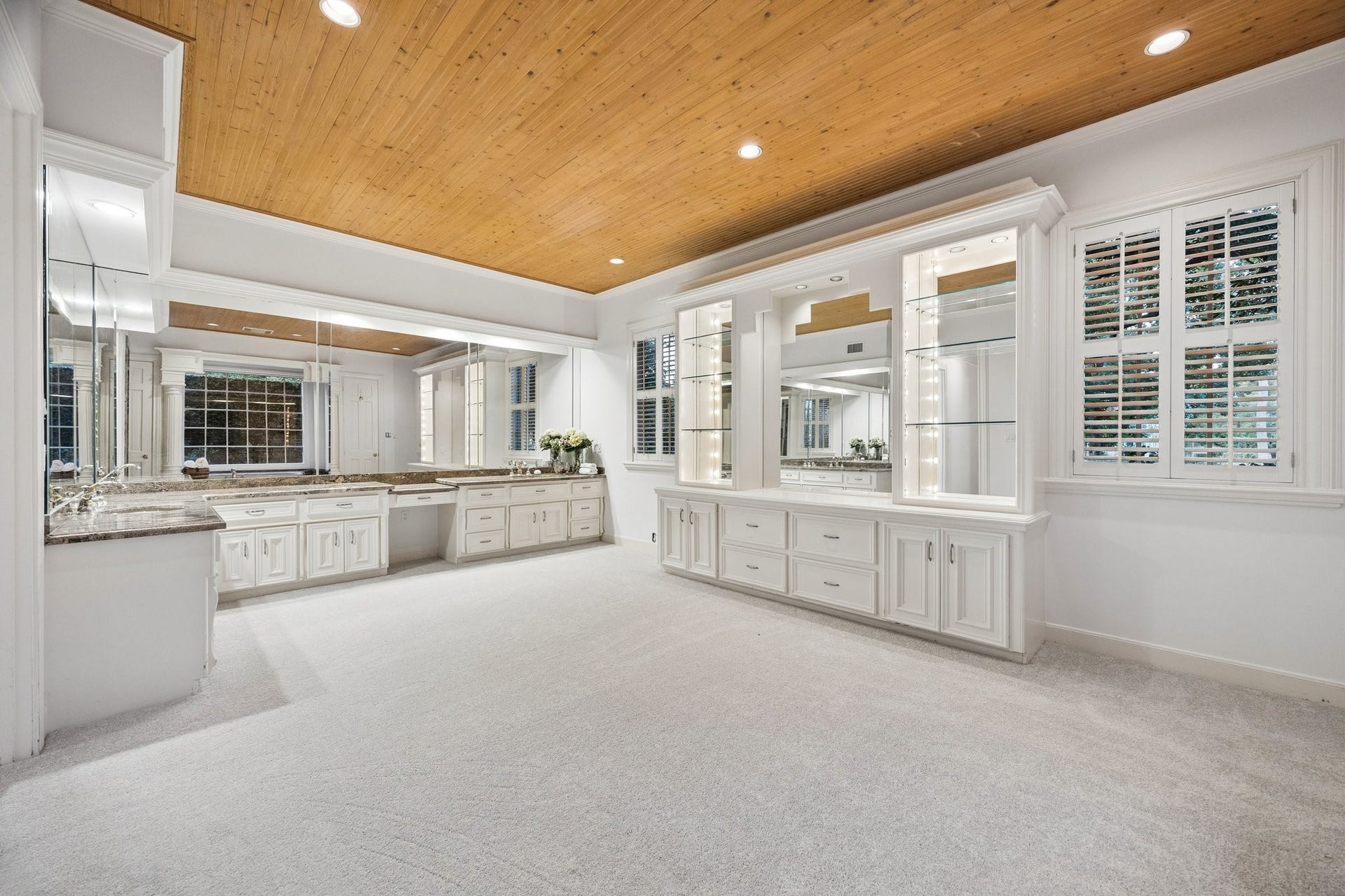 10 Stillforest Street, Piney Point Village, TX 77024 Elegant granite vanities with Kohler sinks, mirrored storage, and refined finishes create a luxurious and functional space designed for everyday comfort.