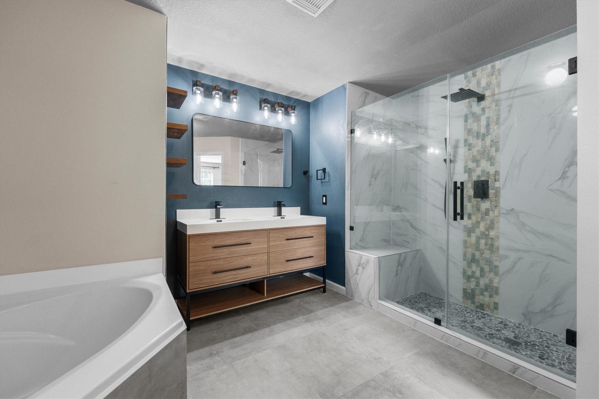 4035 Pedernales River Lane, Spring, TX 77386 Relaxing primary en-suite featuring a large soaking tub and spacious updated walk-in shower.