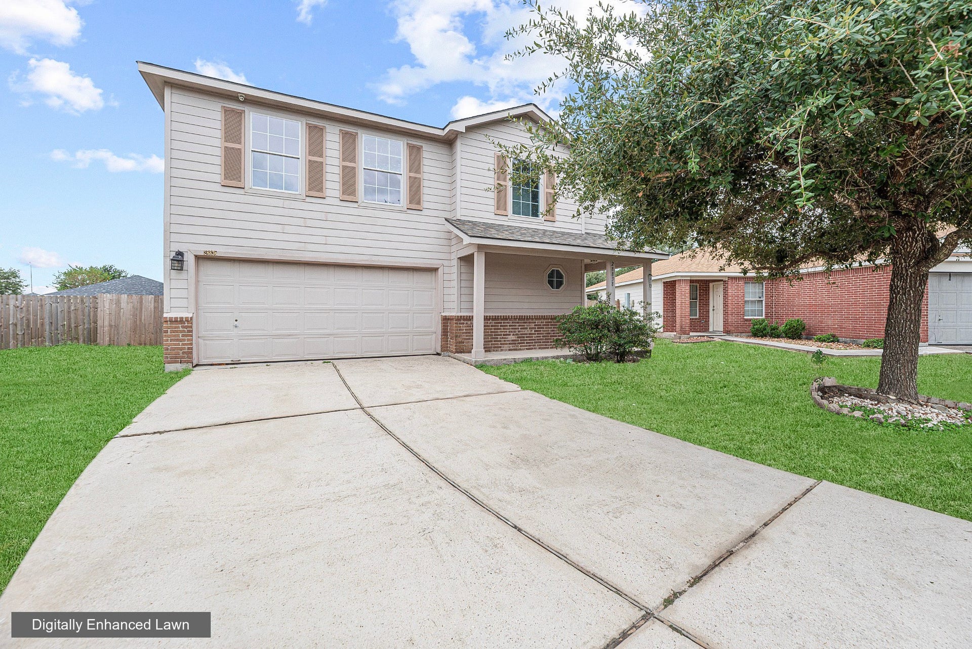 28838 Frio River Loop, Spring, TX 77386 Two-story exterior pairs neutral siding and brick accents with an attached garage and covered entry.