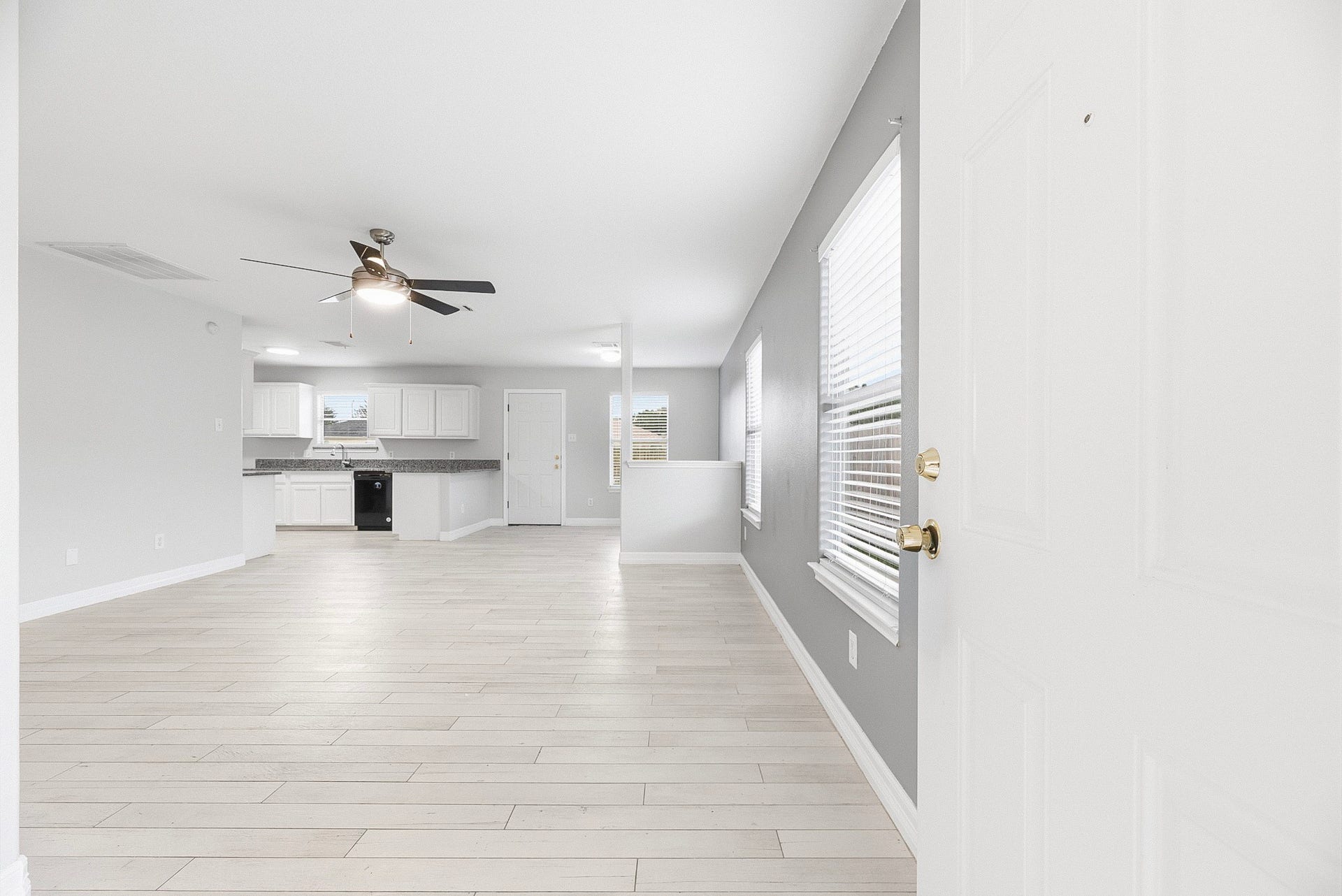 28838 Frio River Loop, Spring, TX 77386 The front entry opens to a bright living area with coordinated flooring and neutral finishes.