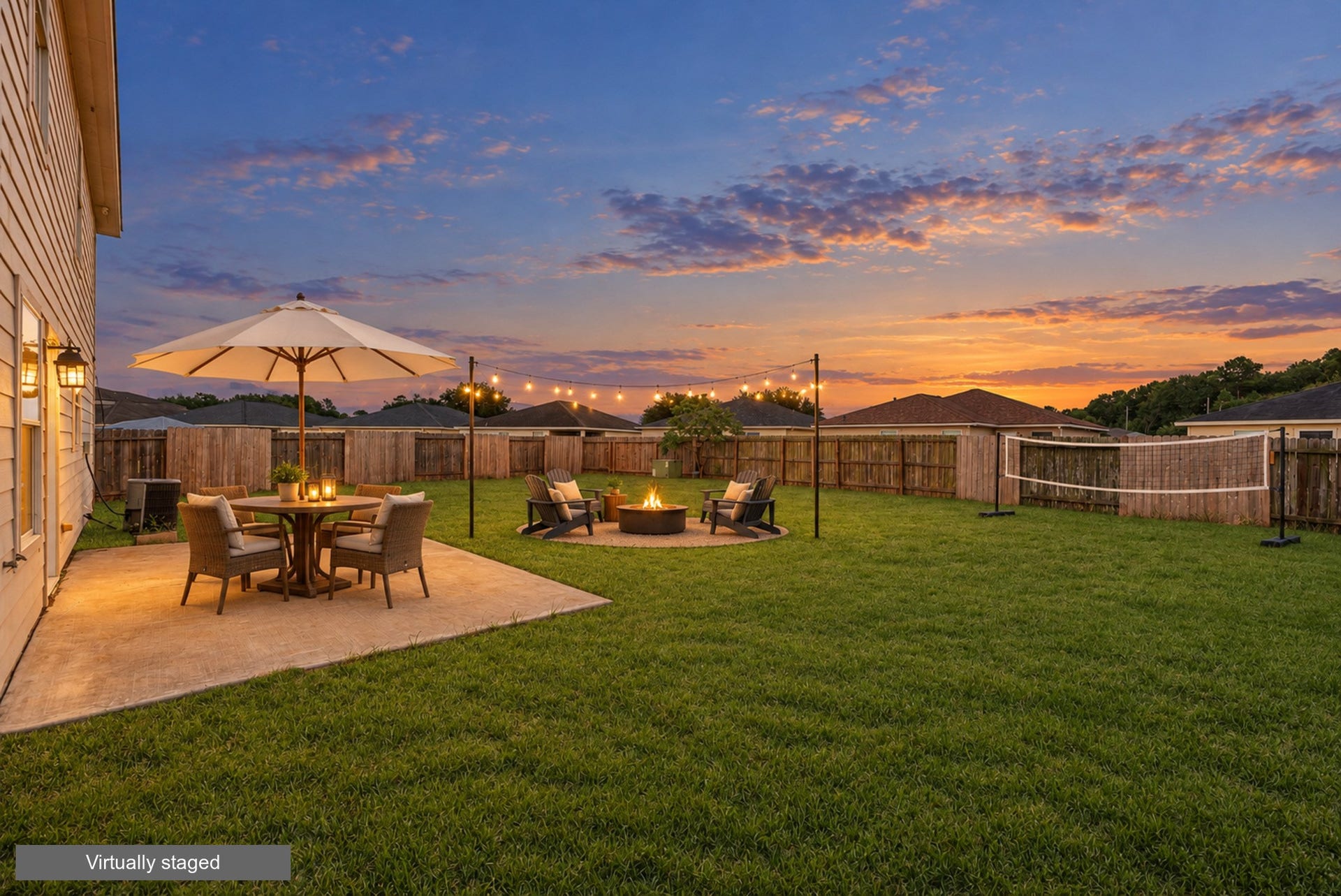 28838 Frio River Loop, Spring, TX 77386 Twilight backyard concept illustrates outdoor seating, string lights, a fire pit, and a volleyball area. (Virtually staged)
