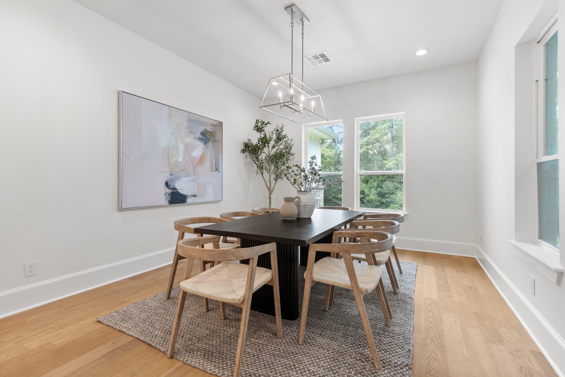 This dining room is open and inviting, providing ample space for large family gatherings and seamless entertaining.