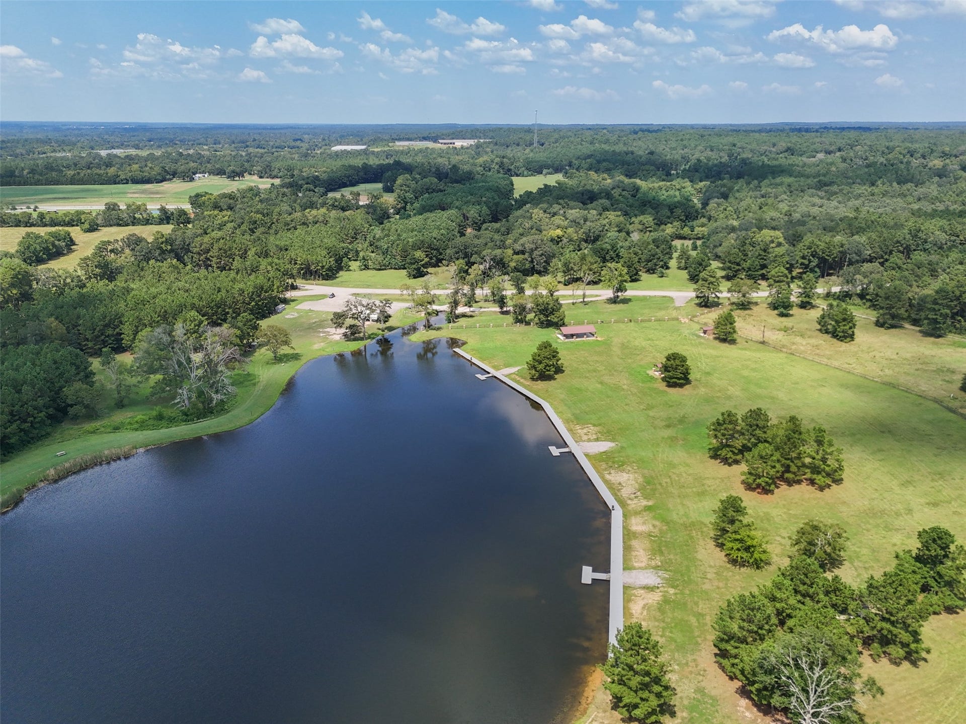 This sprawling lake, complete with private fishing docks and an expansive, manicured lawn, offers a perfect setting for outdoor relaxation and recreation.
