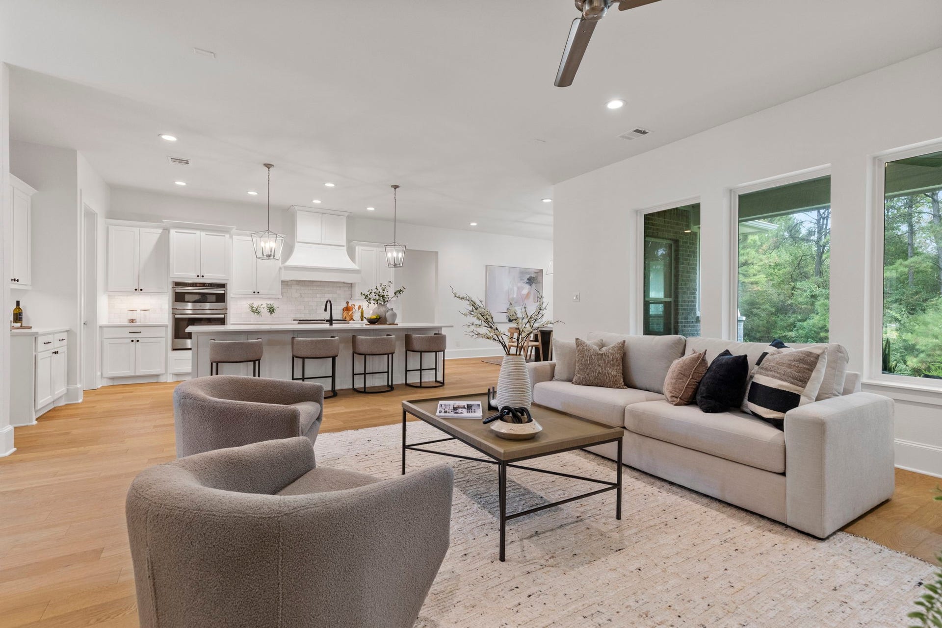 The family room features an inviting, open-concept layout that flows seamlessly into the kitchen, creating an ideal space for both entertaining and everyday living.