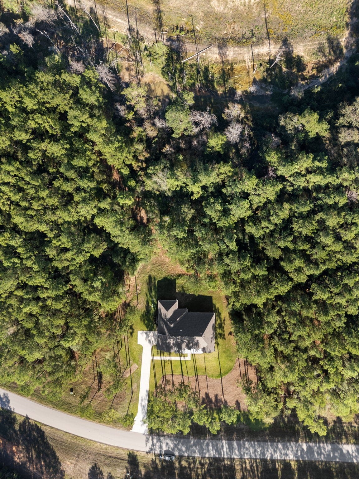 This impressive custom home is perfectly positioned on a private 1.9-acre lot, offering an ideal balance of curb appeal and seclusion.